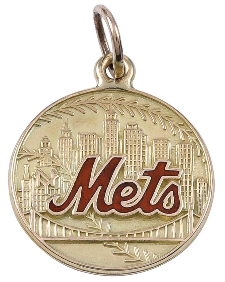 Round 14K disc charm, with embossed New York skyline scene.  The 