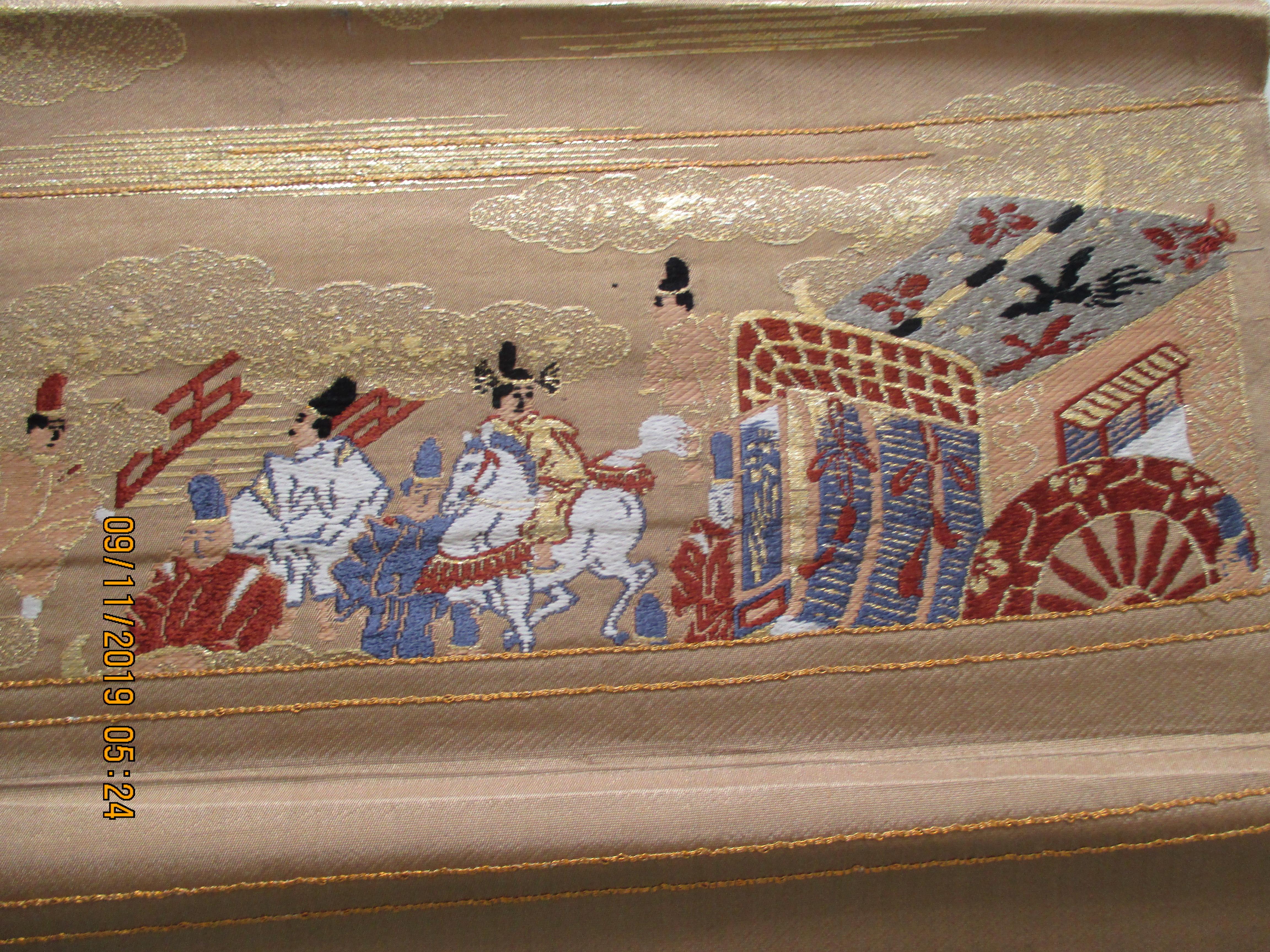 Obi antique textile with street scene with chariot and clouds.
Sold as is.
Ideal for pillows.
Size: 13