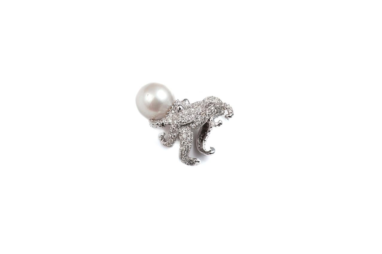 Gold octopus ring with pearl and white diamonds

Gold 16,10 gr (9K)
 207  white diamonds 3,38 ct
1 white pearl 

Size is adjustable from 6 US to 6 1/2 US ( italian size from 12 to 13)
Other sizes on demand, working time approx 15 days.
