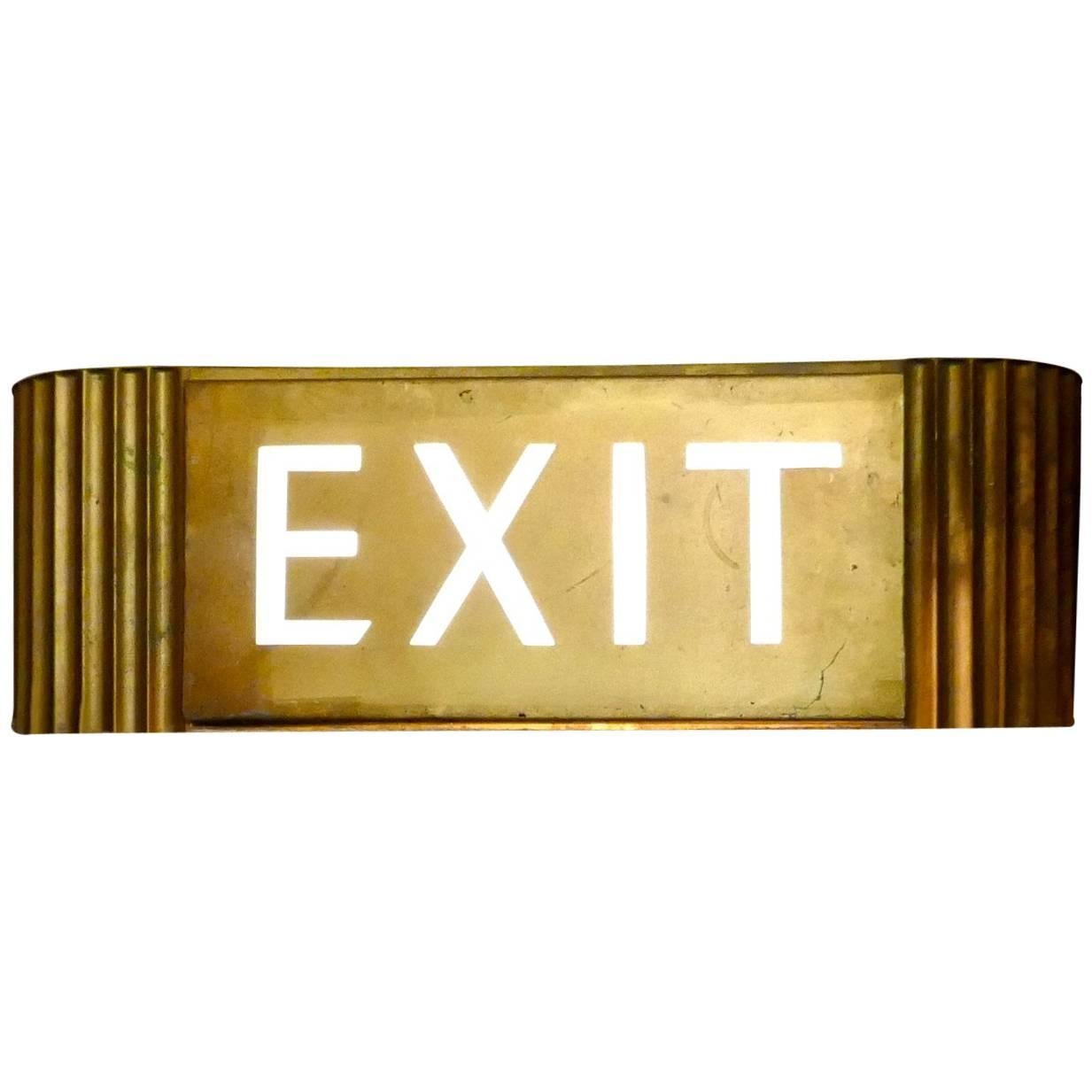 Enseigne EXIT du cinéma Odeon:: couleur or:: éclairage électrique