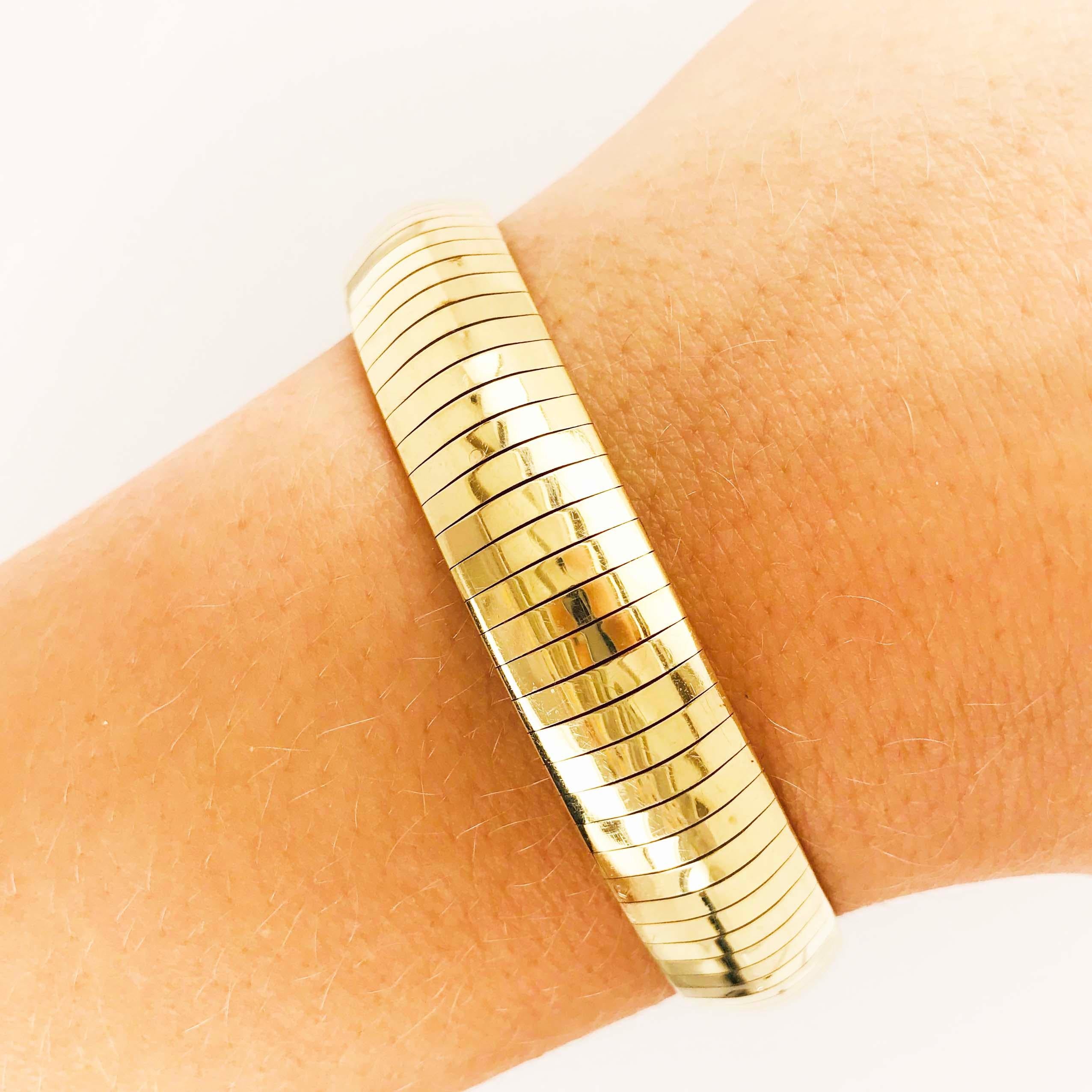 The 14kt yellow gold omega bracelet is Circa 1995.  This is during the time that they made the bracelets thicker and more sturdy.  The bracelet is 11 millimeters wide and 7 inches long.  It has a rich, buttery color and conforms around your wrist