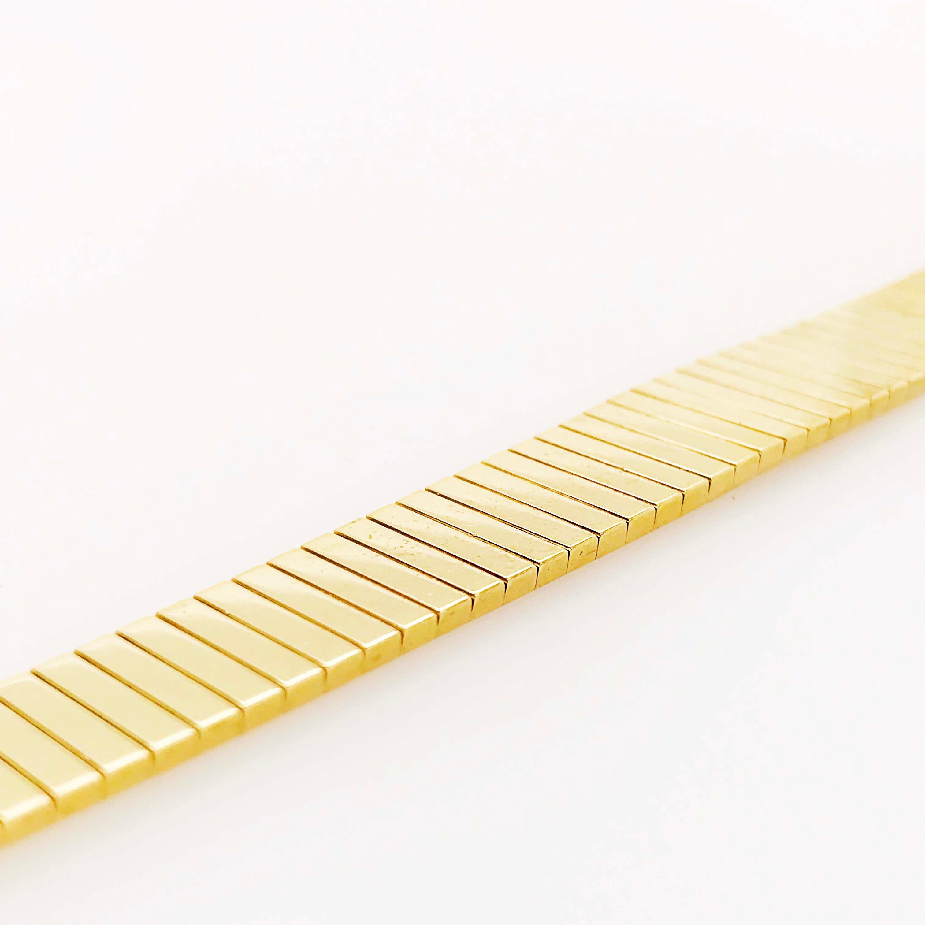 Le bracelet Omega en or jaune 18 carats est royal et ressemble à un bracelet jonc 5