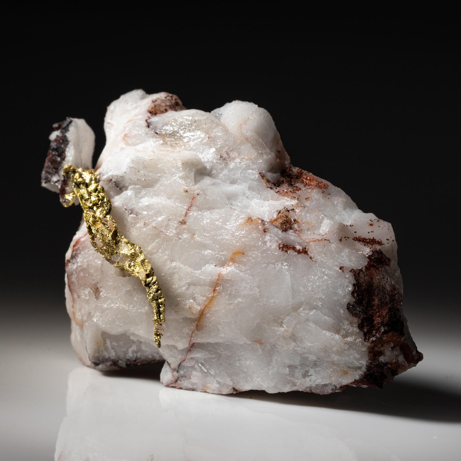 from Aouint Ighoman, Assa-Zag Province, Guelmim-Oued Noun Region, Morocco

 

Well crystallized gold specimen with spinel-law twinning on all sides. The gold is perched atop a quartz matrix. Lustrous rich golden yellow luster. New find from 2021.

