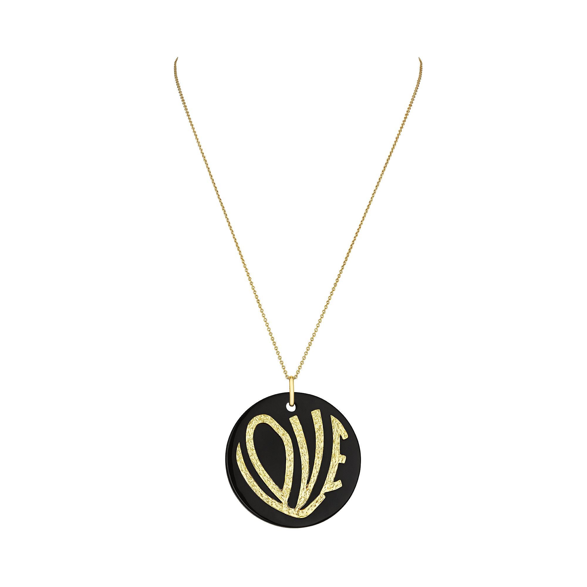 Show your love in full sight with this 1970's inspired large onyx love pendant necklace.  This bold black onyx disc, with the hammered 18 karat yellow gold word LOVE stylishly applied to the front, makes this necklace a powerful and heartfelt