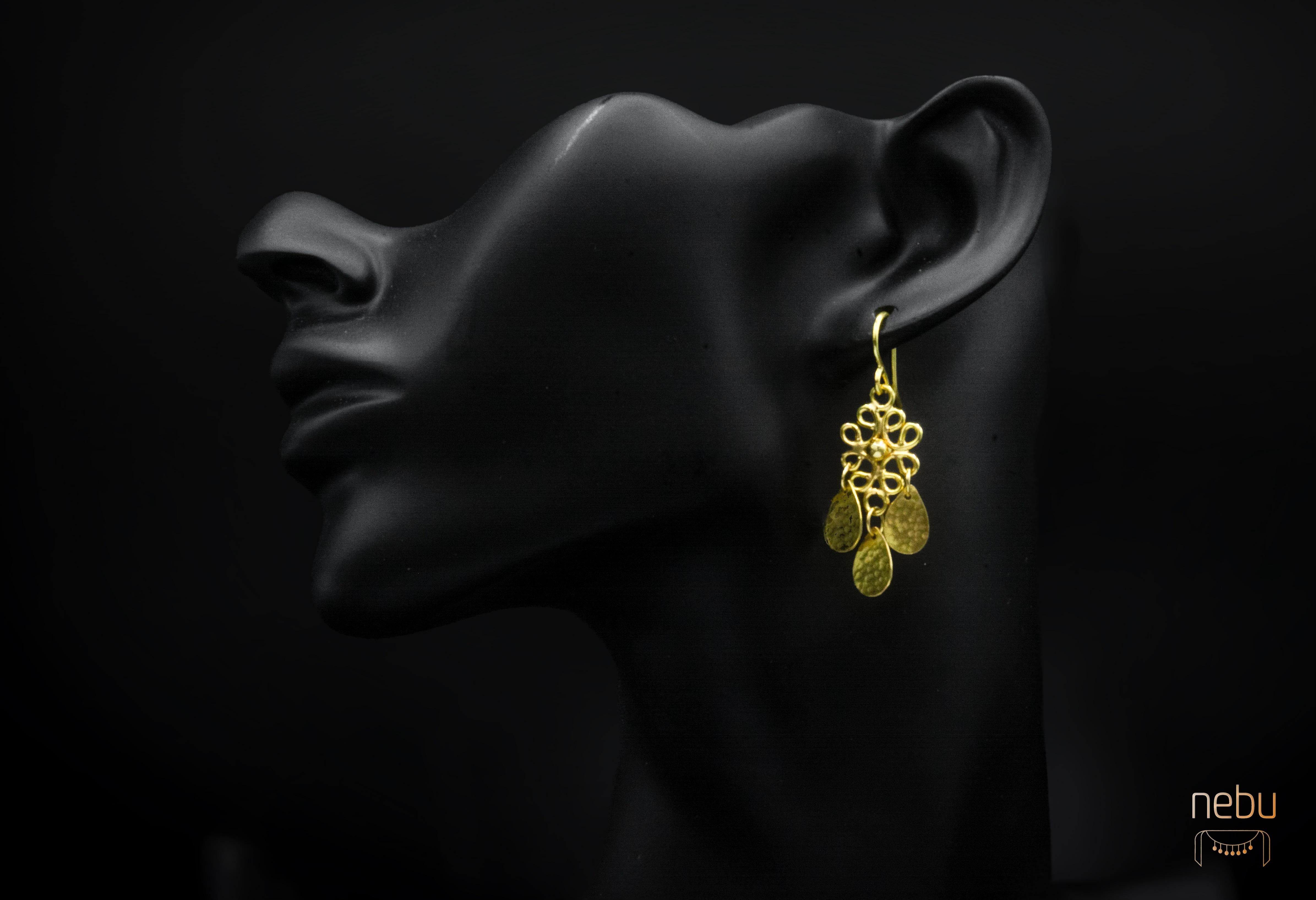 - Available 
-Handmade
- 18K Gold
- 4cm long
-Stamped with the Nebu logo 

Inspired by the intricate motifs found in traditional Indonesian jewelry, these earrings boast delicate open filigree work that exudes elegance and sophistication. Crafted