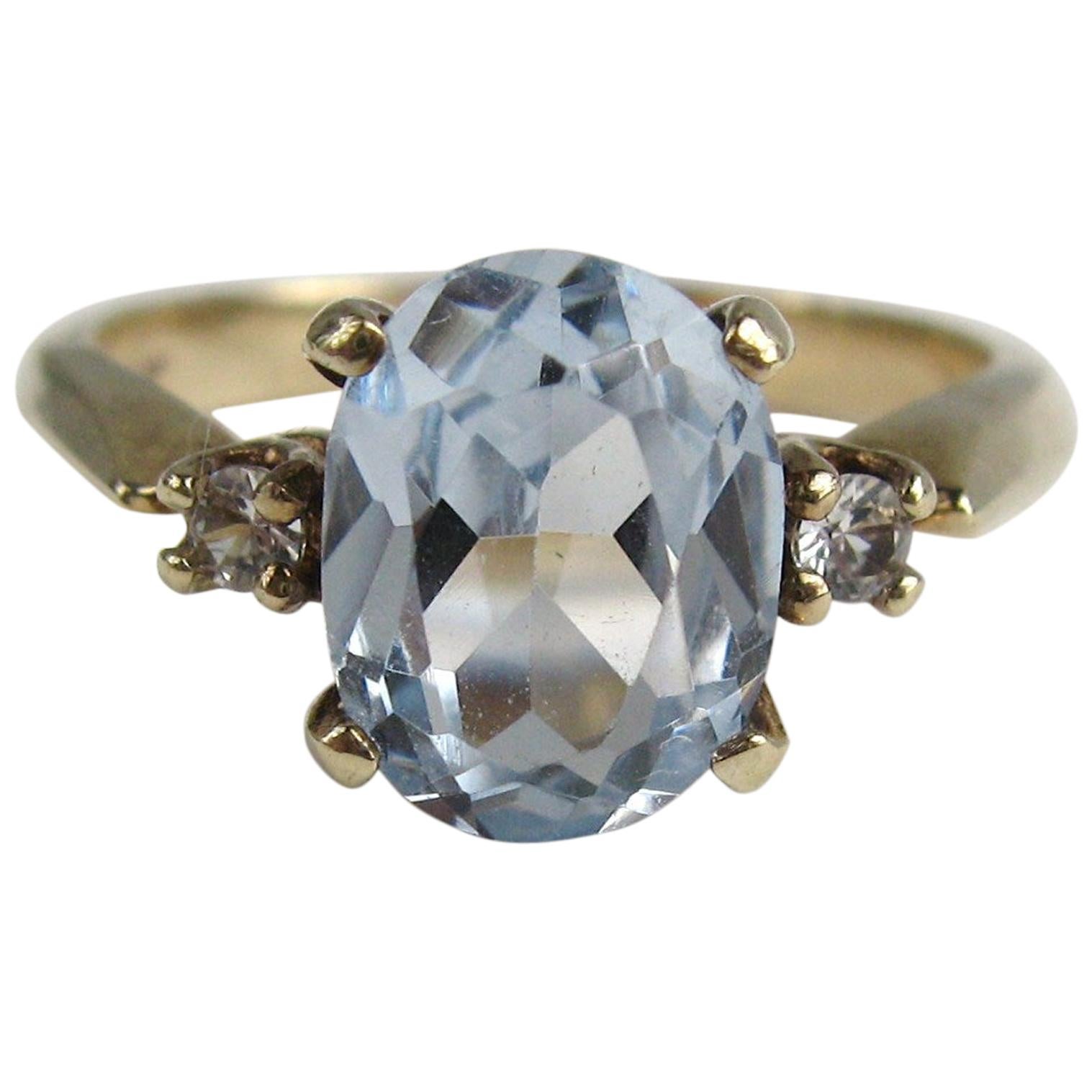 Gold Oval Aquamarine and Diamond Solitaire Ring For Sale