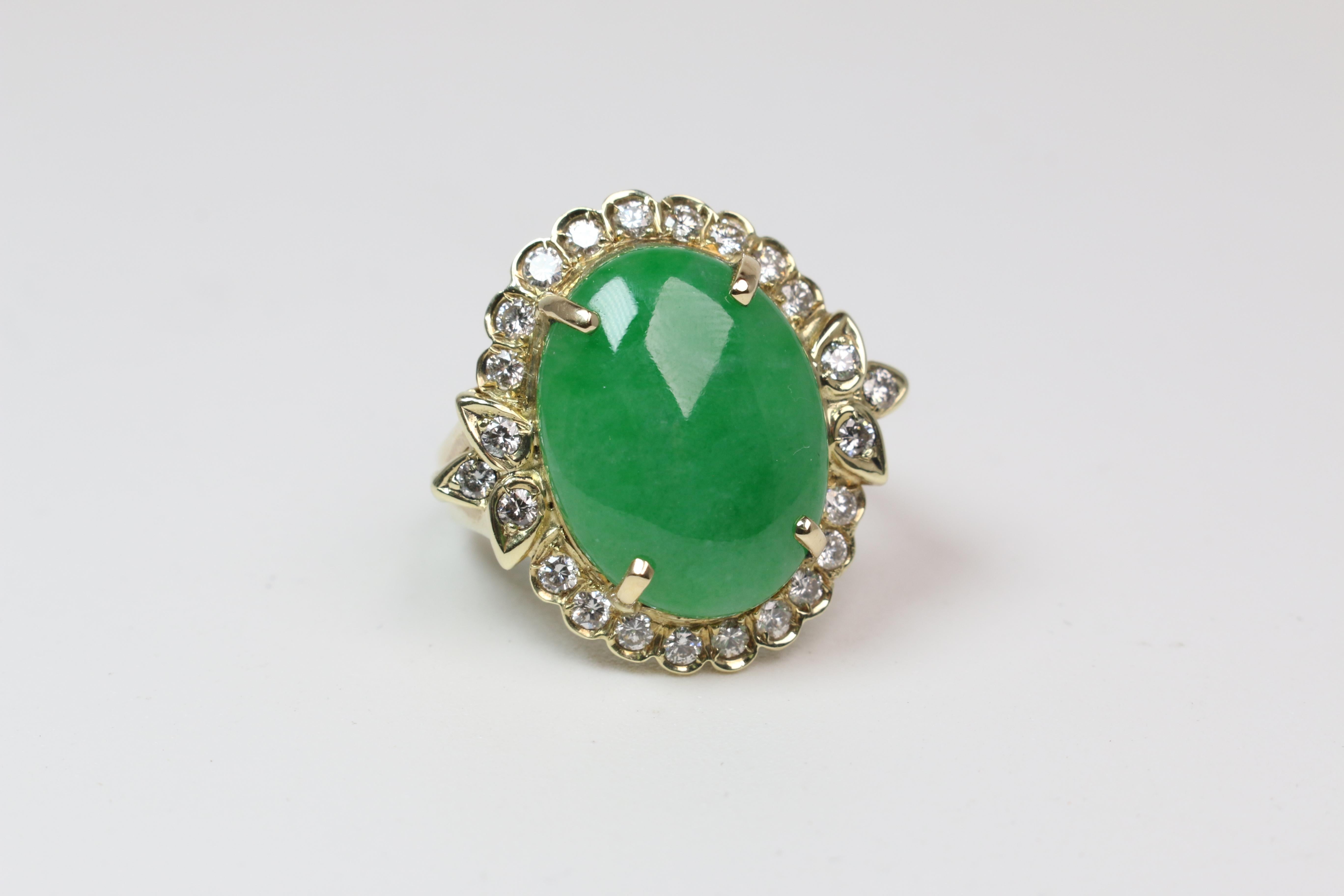 This stunning 13mm x 17mm oval cut jade is set in 14k Yellow Gold with a Diamond Halo. The ring is sized to a 6.5 and can be sized before shipping if needed.