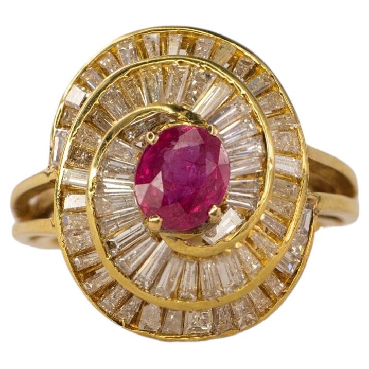 Gold Oval Ruby and Swirling Baguette Diamond Ballerina Ring
