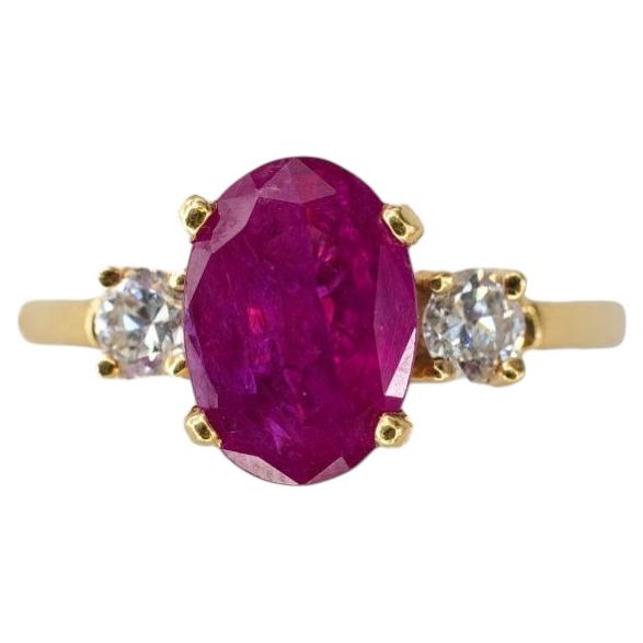 Gold Oval Ruby and Three-Stone Diamond Ring