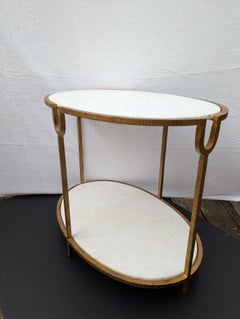 Gold painted iron and marble oval side table