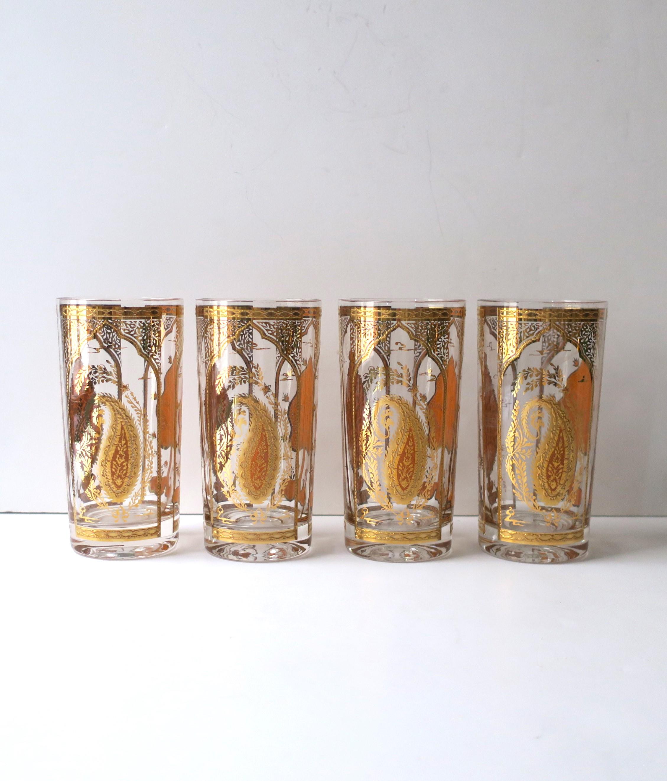 A beautiful set of four (4) 22-kt gold paisley highball cocktail glasses with Moorish pattern, by Culver, Brooklyn, New York, circa mid to late-20th century. This design is a rare and hard to find. Glasses have three design motifs, paisley,