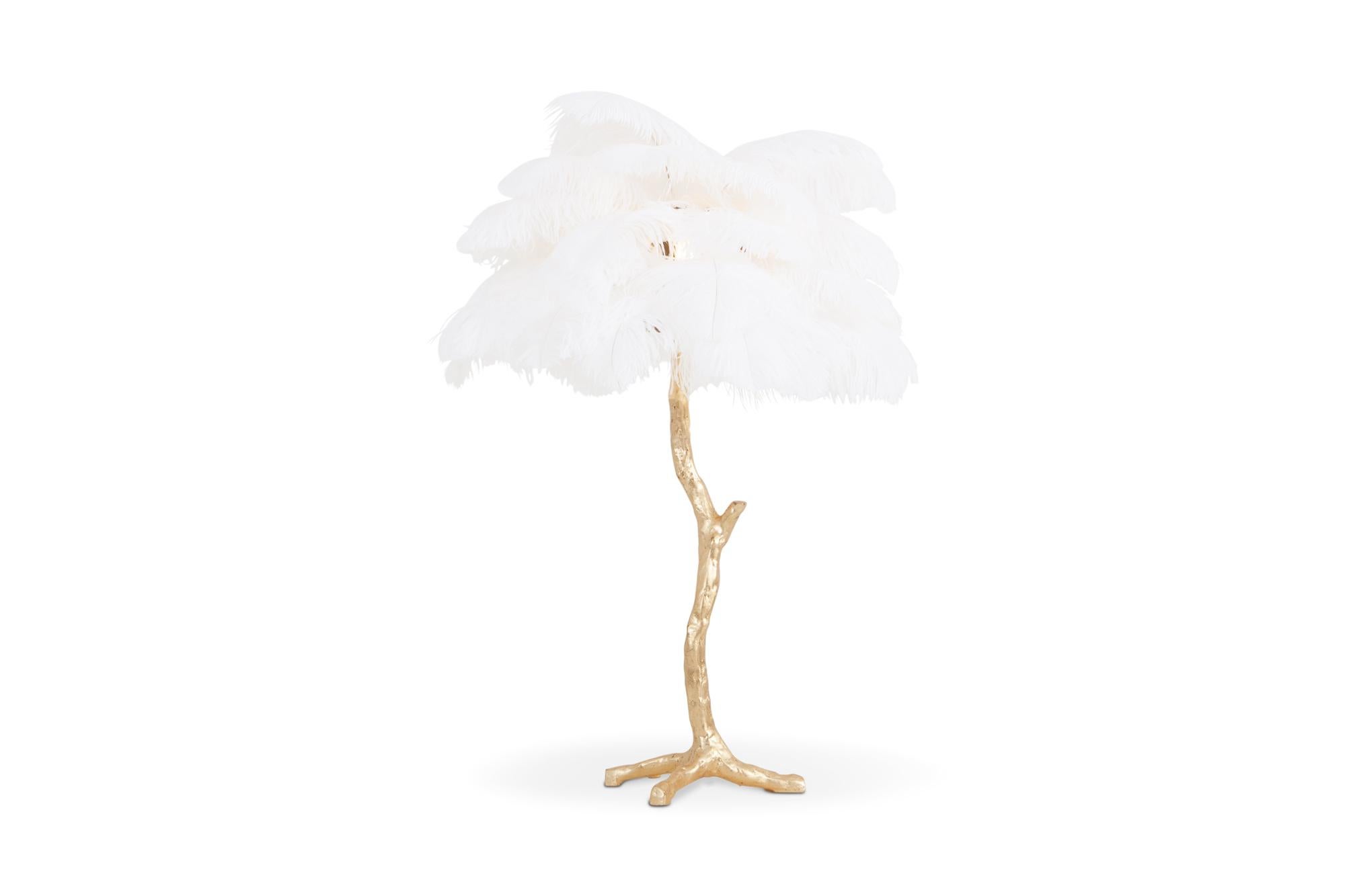 Contemporary Hollywood Regency lamp with golden resin stem and white colored ostrich feathers

Decorative luxury piece that fits well in an eclectic Hollywood Regency inspired metropolitan interior

We can also offer the larger floor lamp model.