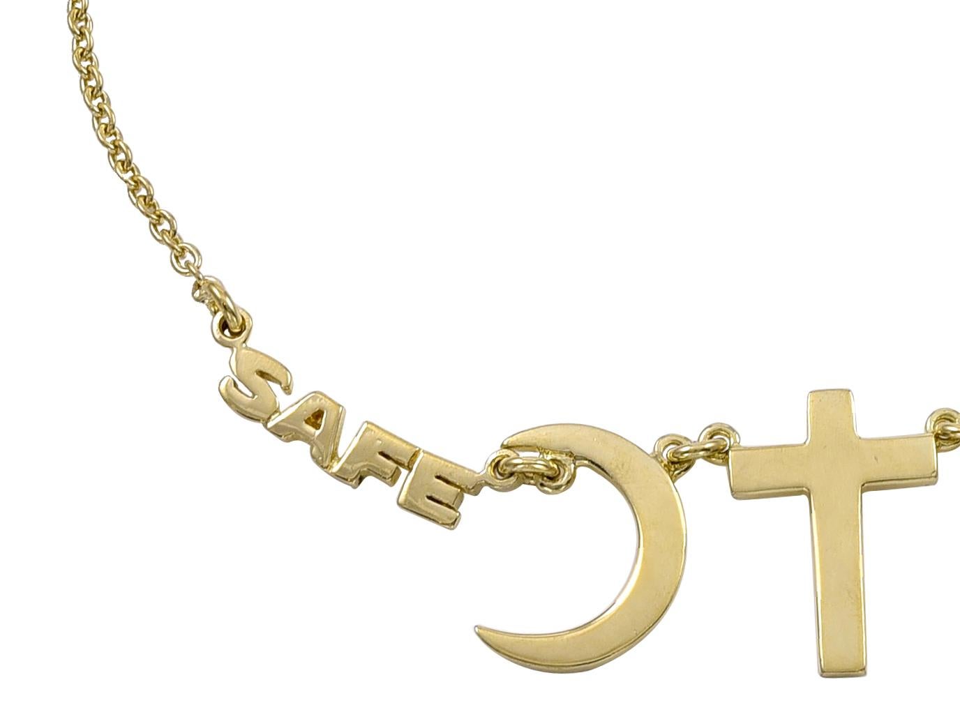 Unique necklace, with symbols representing the Muslim, Christian and Jewish religions.  On either side of the symbols, there are letters spelling out 