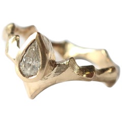 Gold Pear Solitaire Ring with Angled Band