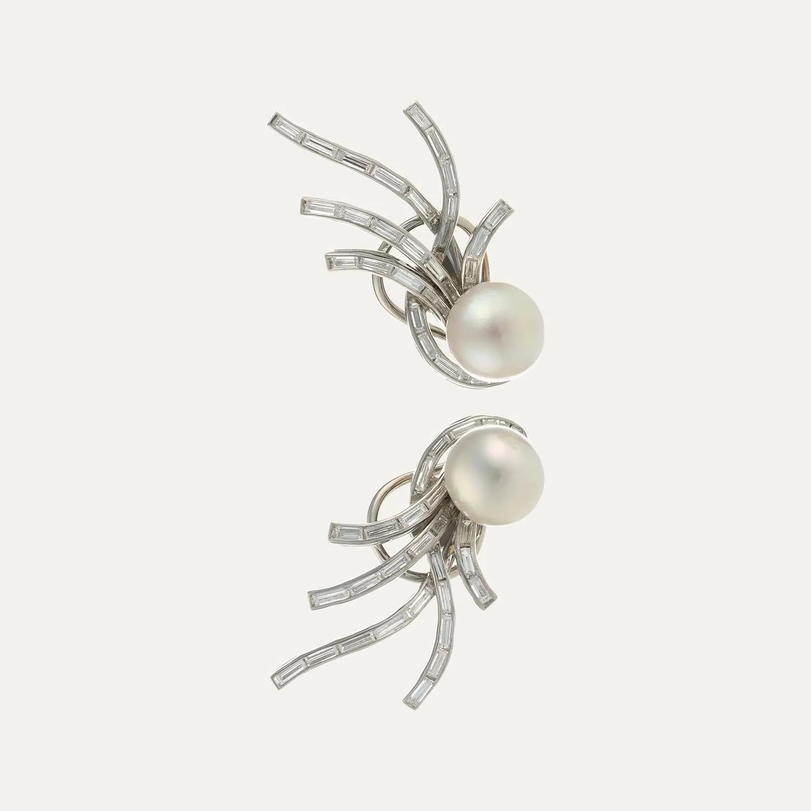 White gold earrings with 2 white pearls 9.5 mm in diameter and 46 baguette-cut diamonds, weighing around 2.10 ct. Omega spring system. Europe, circa 1960.