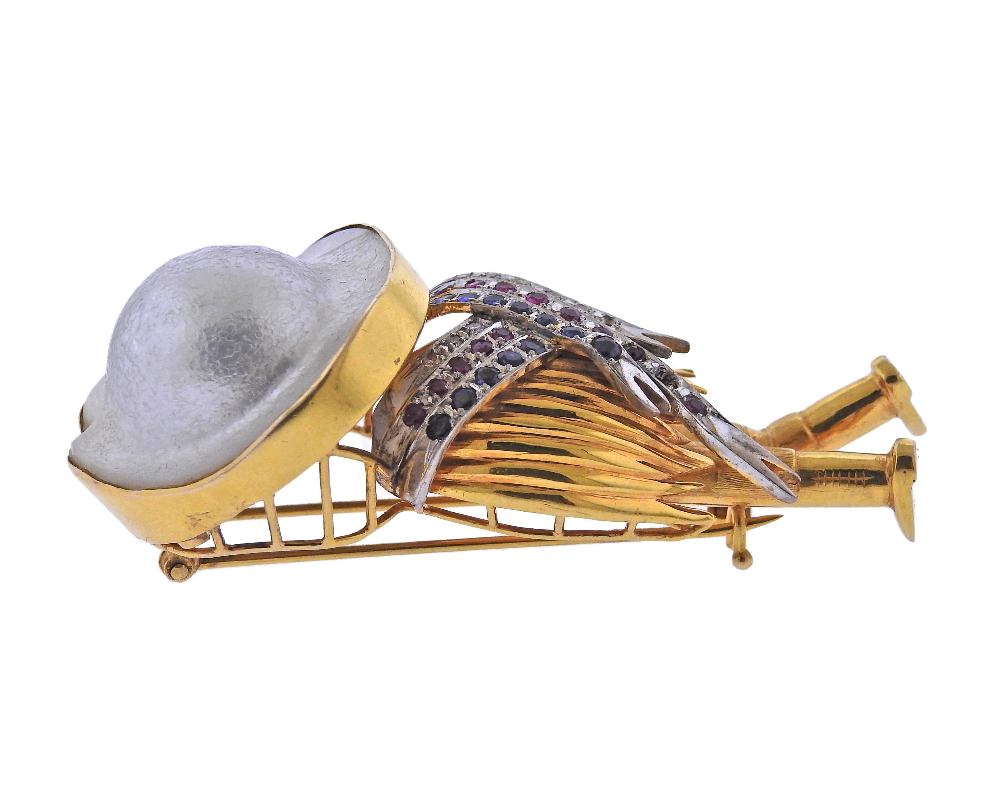 14k gold brooch, depicting a man in sombrero hat, with 28mm blister pearl, rubies, sapphires and diamonds (1 is missing). Brooch measures 65mm x 30mm. Tested 14k. Weight - 31.8 grams.