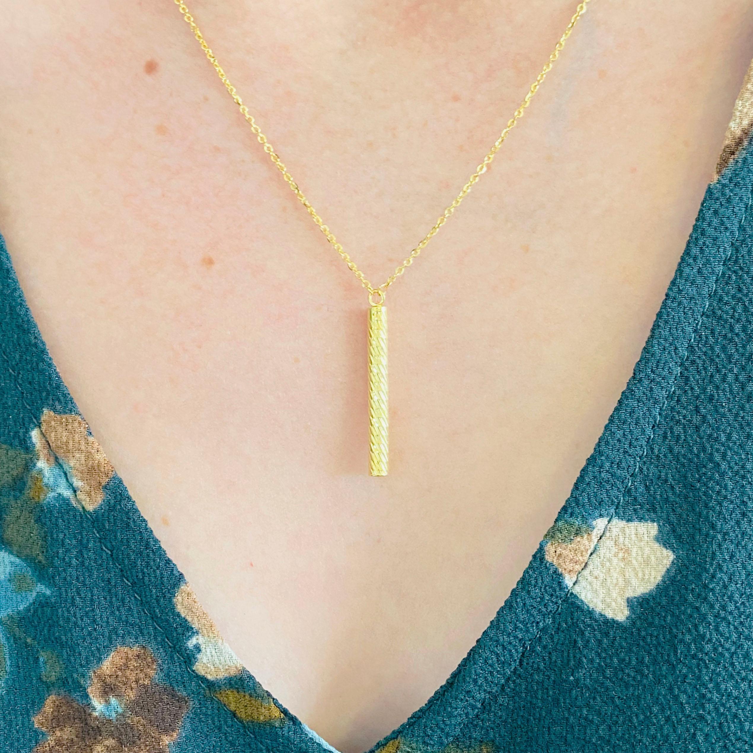 This gorgeous 14k yellow gold textured cylinder pendant necklace is the perfect mix between classic and trendy! This necklace is very fashionable and can add a touch of style to any outfit, yet it is also classy enough to pair easily with formal