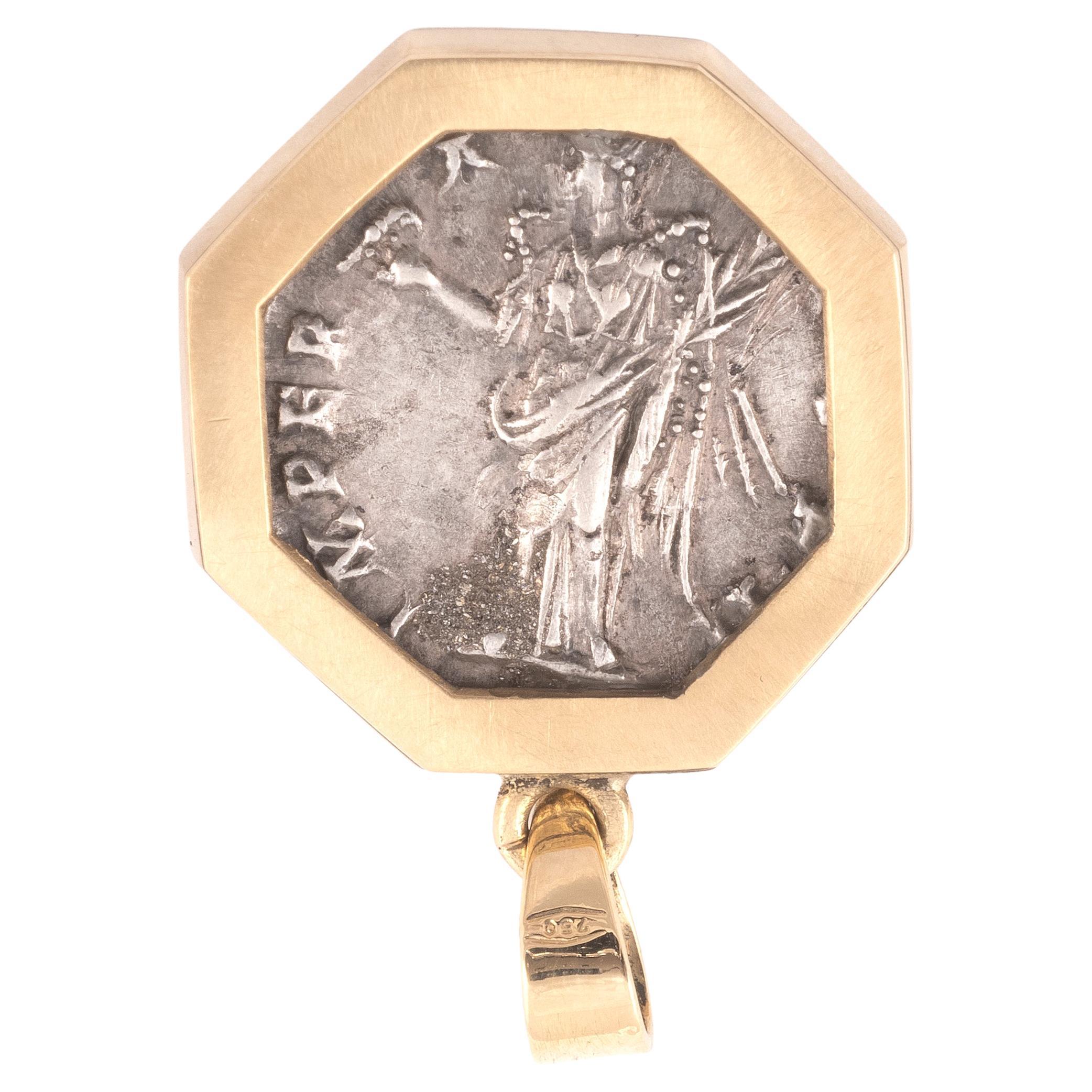 18kt Yellow brushed gold 7.49 Grams height 3 cm

This Genuine Ancient Coin Has Been Mounted in a Stunning Modern 18 Karat Gold Pendant.
Antoninus Pius is regarded as one of the 