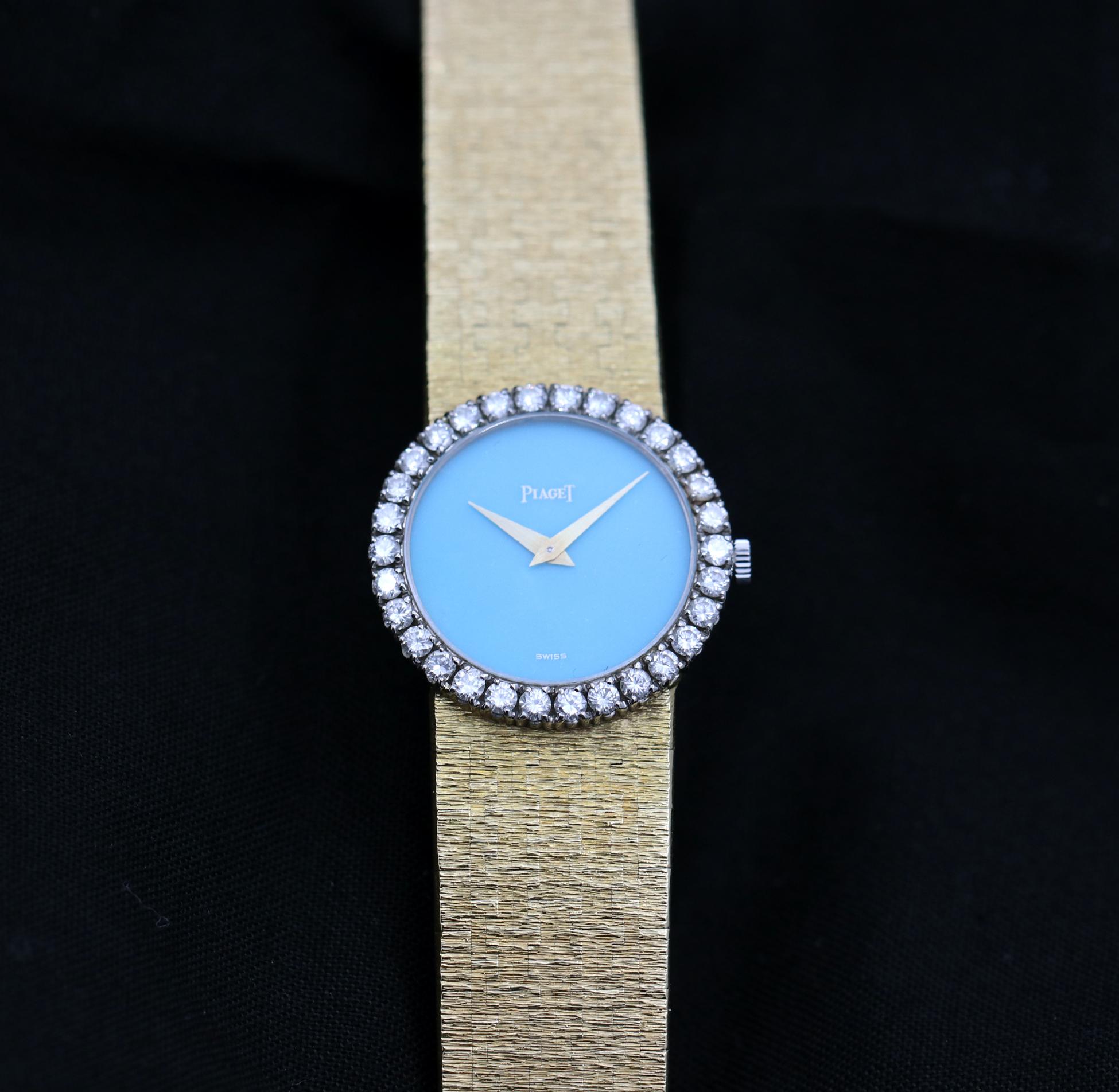 Women's Gold Piaget Wristwatch with Turquoise Dial and Diamond Bezel