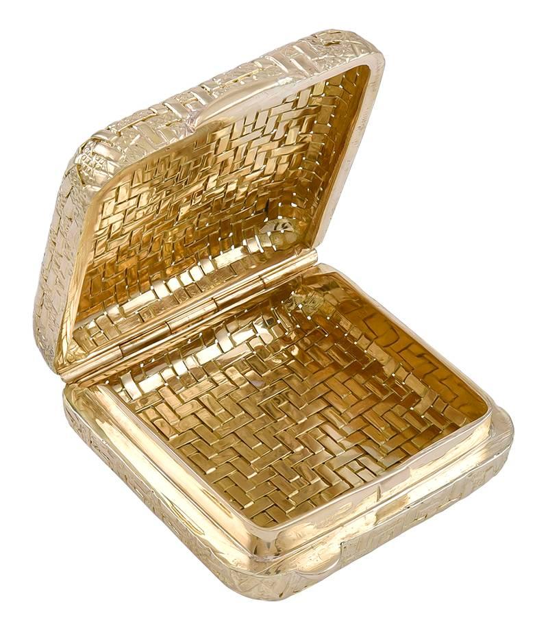Solid and very handsome hinged pill box.  Heavy gauge 18K yellow gold, slightly flexible.  Textured basketweave background, with shiny gold chevron pattern.  1 1/4