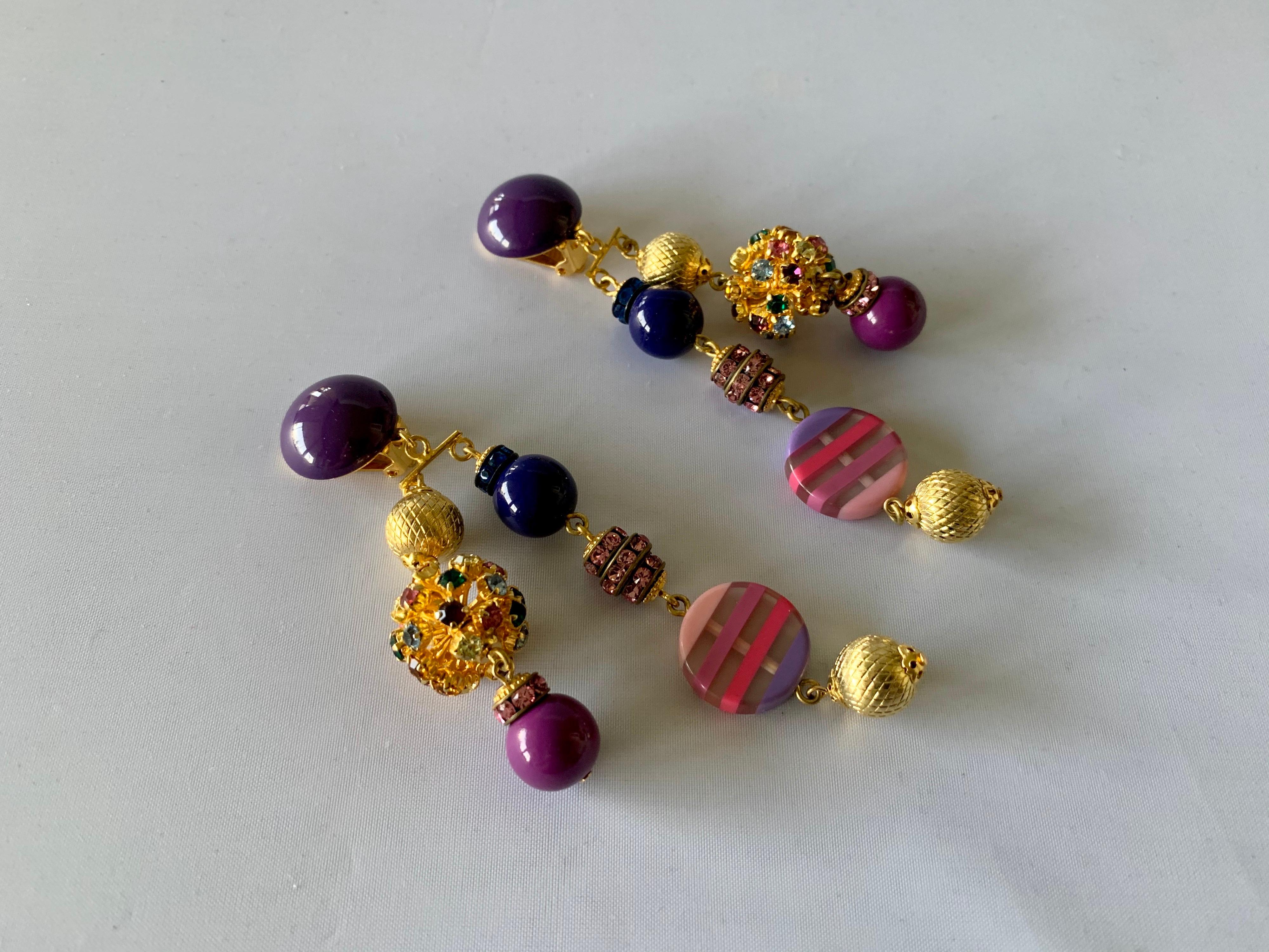 Contemporary gold, pink, and purple French clip-on statement earrings comprised out of gilt metal findings and vintage glass beads, handmade in Paris France by Francoise Montague.