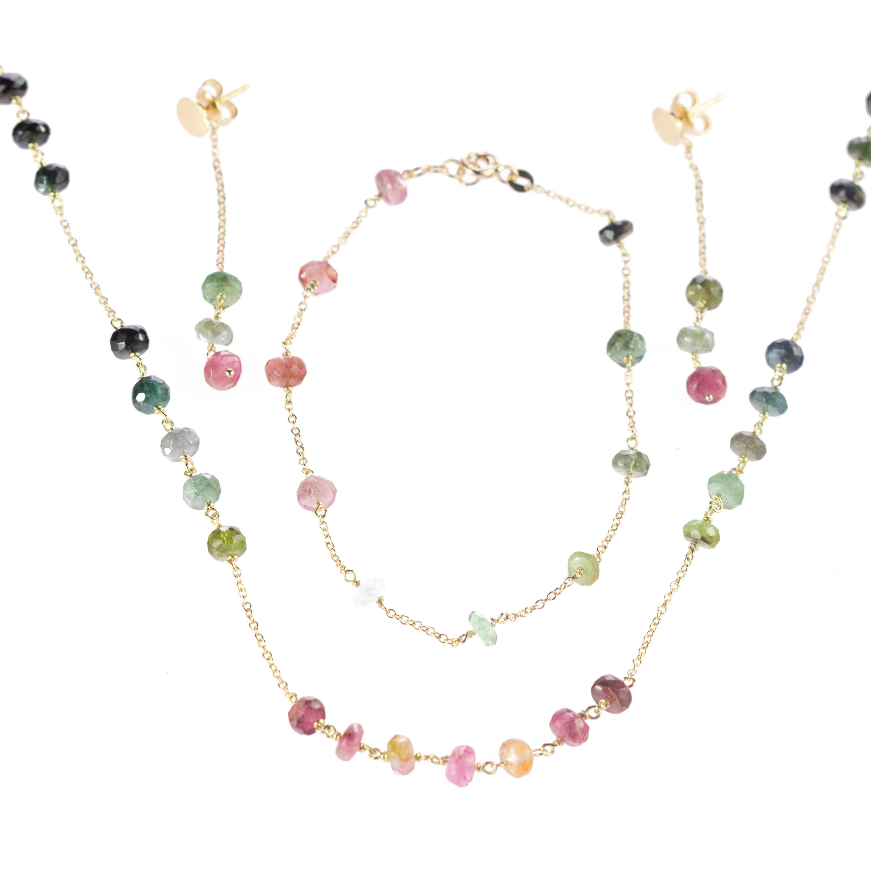 Delight yourself with a luminous handmade jewelry. A rondelles tourmaline set of earrings, necklace and bracelet full of design. A modern and delicate style for a young and fearless woman. A modern and artisan rondelle cut gems, immersed in a Gold