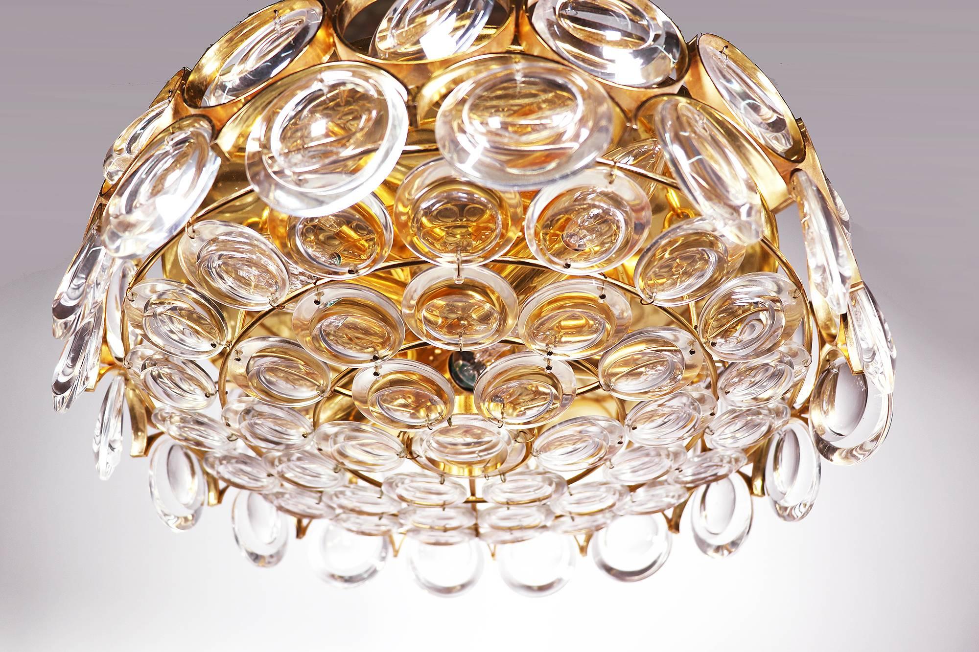 Elegant gold-plated and crystal glass flush mount chandelier designed by Christoph Palme. Chandelier illuminates beautifully and offers a lot of light. Gem from the time. With this light you make a clear statement in your interior design. A real