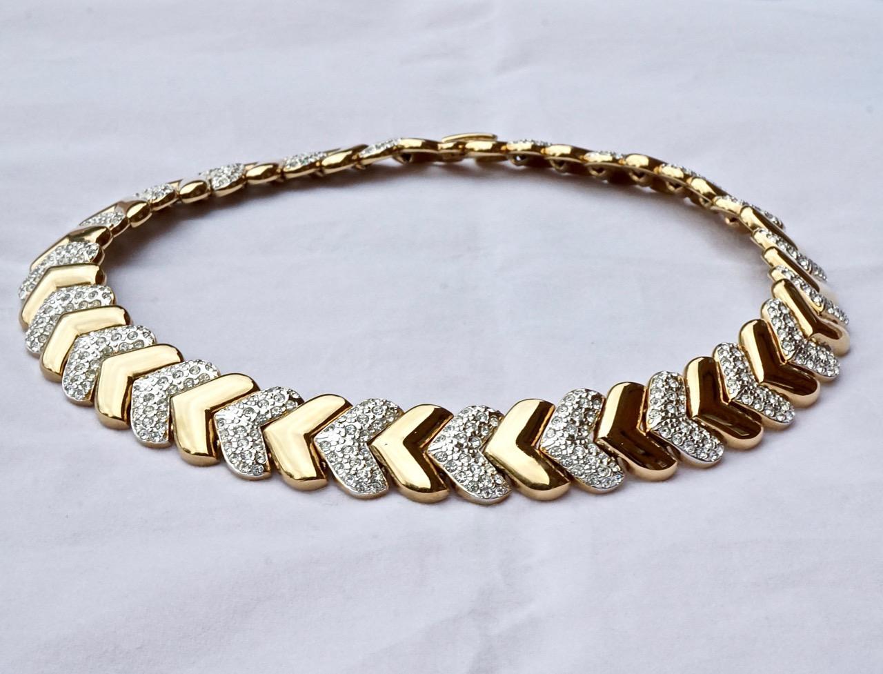 Fabulous gold plated heavy chevron necklace, featuring alternating shiny gold plated and silver plated rhinestone set links. It is made to curve beautifully around the neck. Measuring length 42.5cm / 16.7 inches by width 1.8cm / .7 inch. The