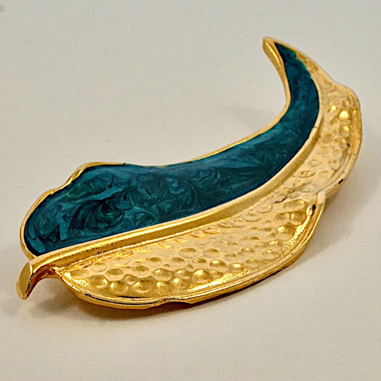 Stylish gold plated leaf brooch with teal enamel. This is a large brooch measuring length 8.4 cm / 3.3 inches by width 3.65 cm / 1.4 inches. The brooch is in very good condition.

This lovely statement leaf brooch is circa 1980s.