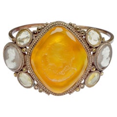 Gold Plated Bangle with Amber Glass Intaglio and Faux Cameo and Glass Surround