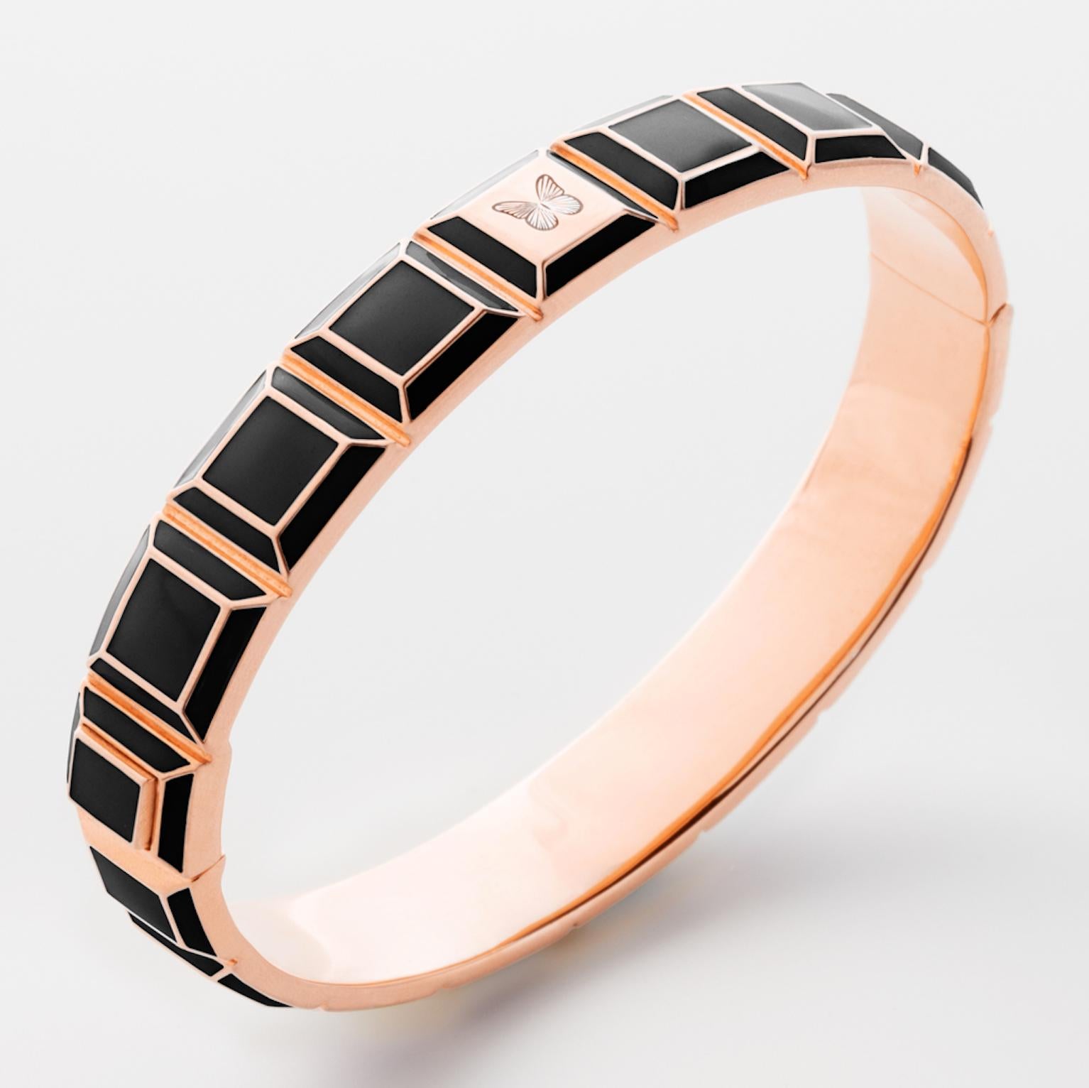 Gold-Plated Enamel Carousel Bracelet features a Rose Gold Plated Silver bracelet with Black Enamel and Butterfly engraving, along with a clasp closure that secures the bracelet onto the wearer's wrist. 
Rose Gold Plated Silver, Black Enamel
From the