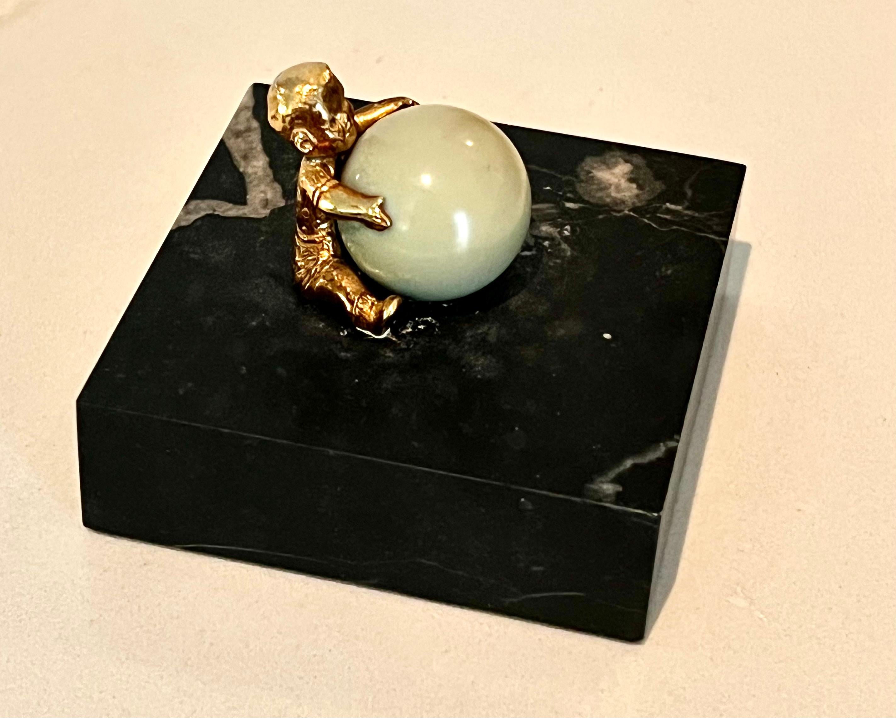 Gold Plated Boy Holding a Large Jade Sphere on a Carrara Marble Base In Good Condition For Sale In Los Angeles, CA