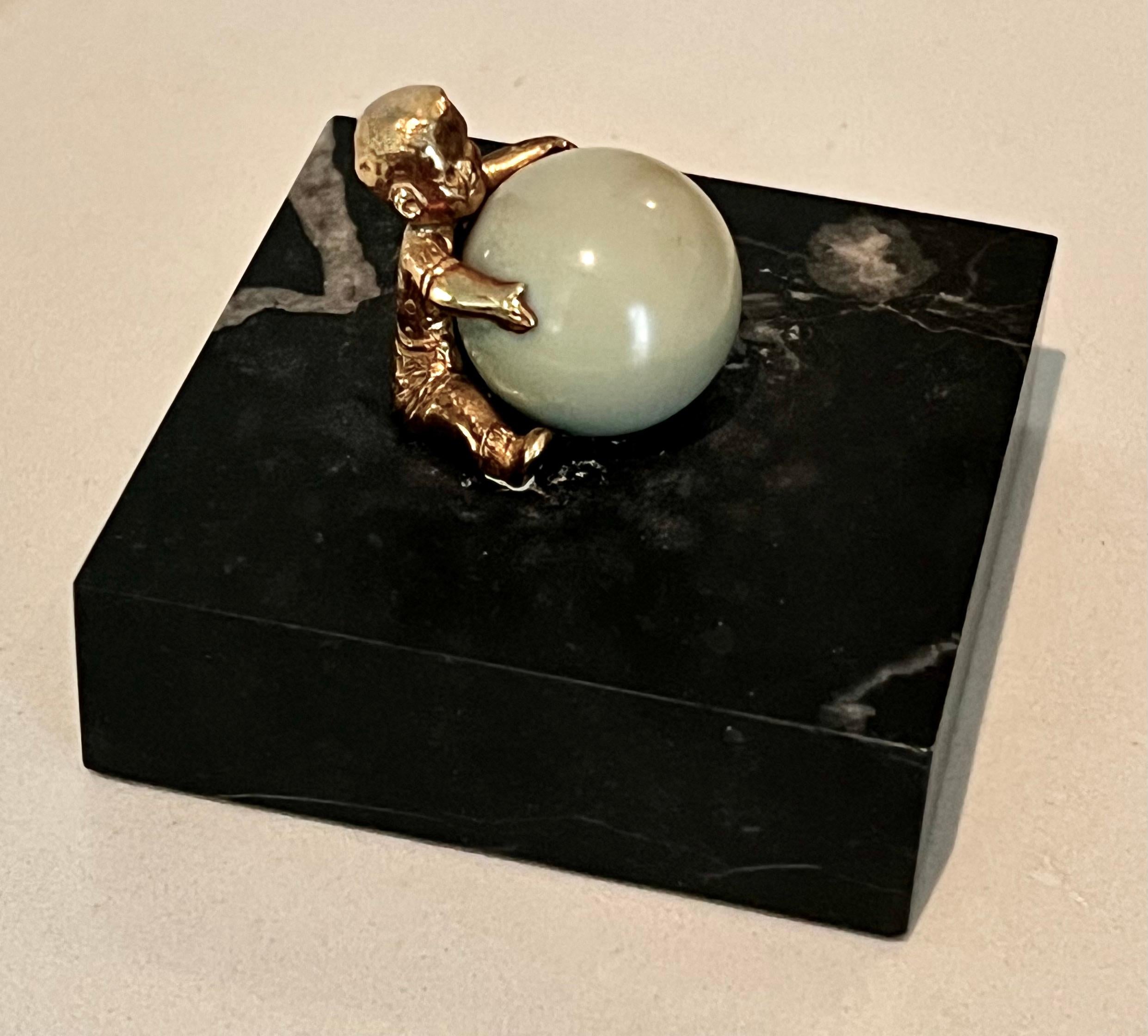 20th Century Gold Plated Boy Holding a Large Jade Sphere on a Carrara Marble Base For Sale