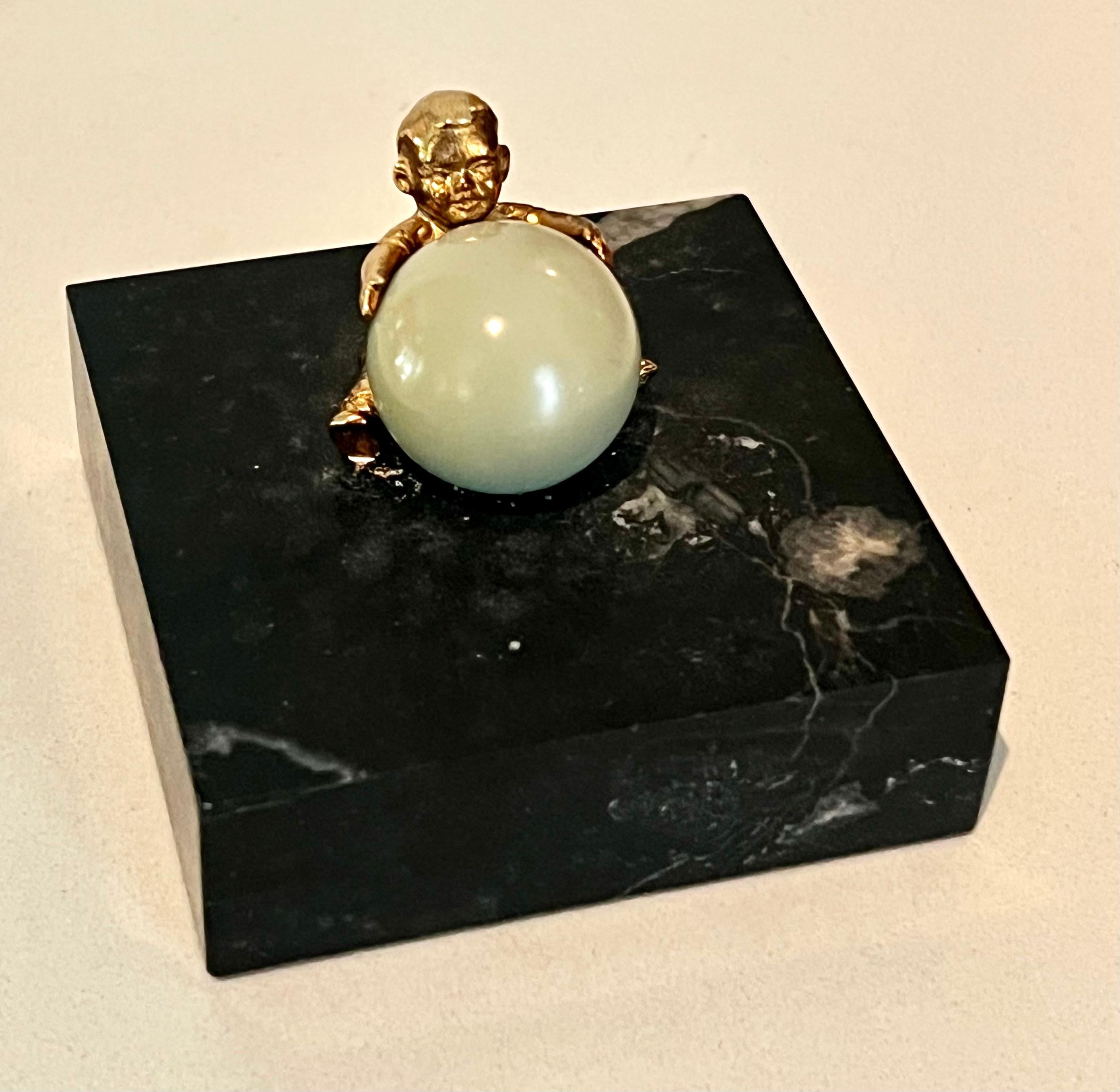Gold Plated Boy Holding a Large Jade Sphere on a Carrara Marble Base For Sale 1