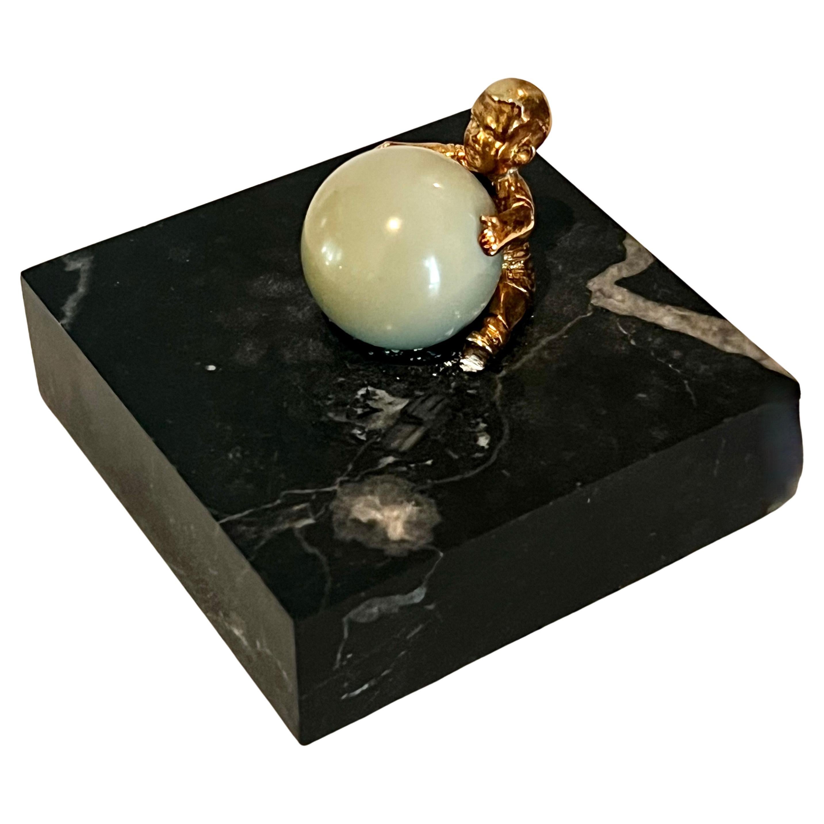 Gold Plated Boy Holding a Large Jade Sphere on a Carrara Marble Base For Sale