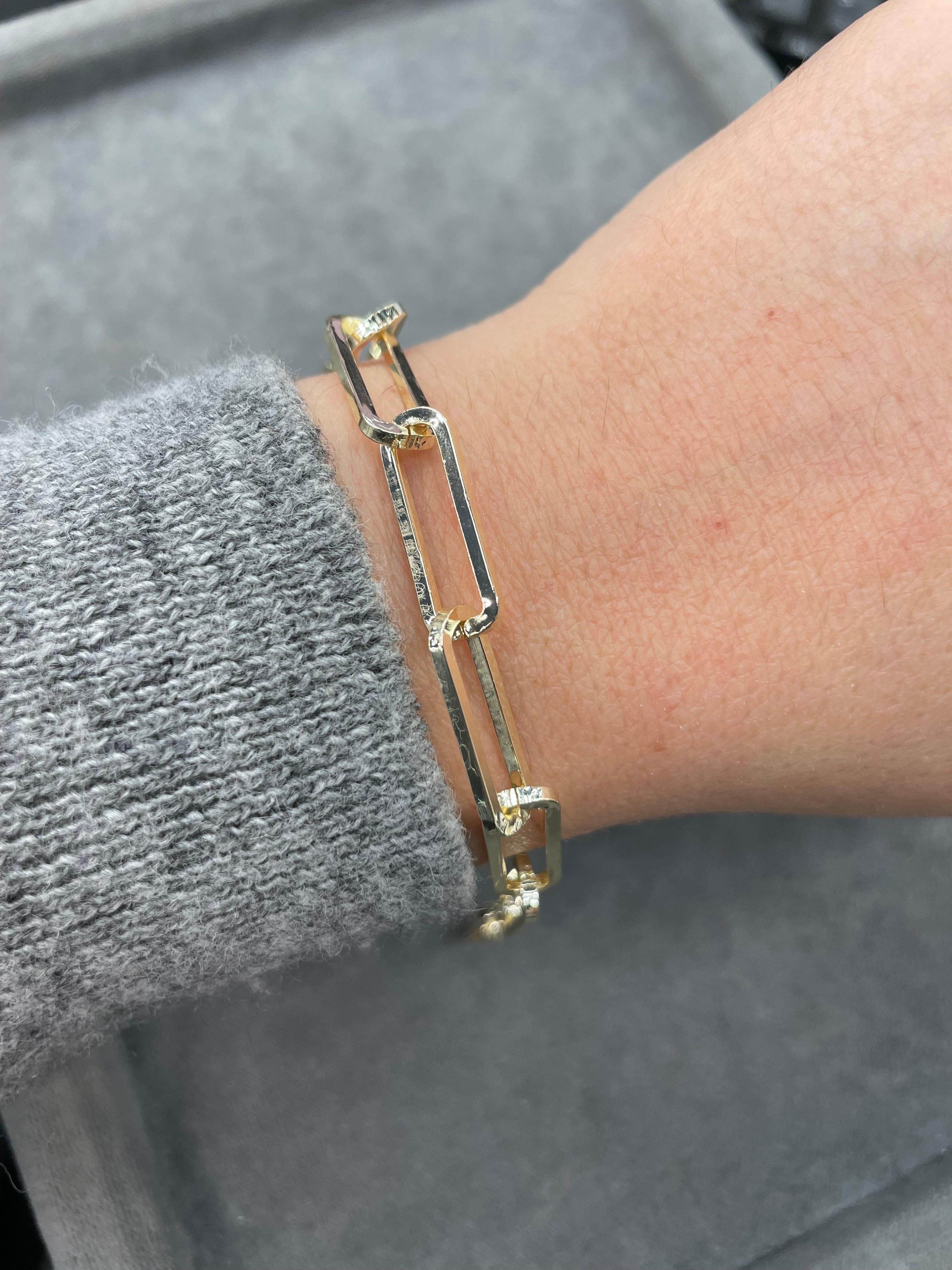 Gold plated brass bracelet featuring 9 paperclips on a chain clasp.
Will not tarnish! 
Bracelet is 7 inches with 1 inch of chain. 