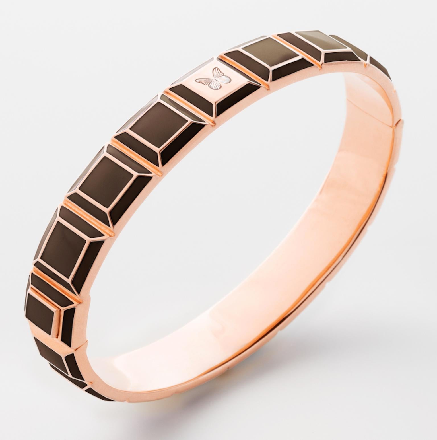 Gold-Plated Enamel Carousel Bracelet features a Rose Gold-Plated Silver bracelet with Brown Enamel and Butterfly Engraving, along with a clasp closure that secures the bracelet onto the wearer's wrist. 
Rose Gold-Plated Silver, Brown Enamel
From the