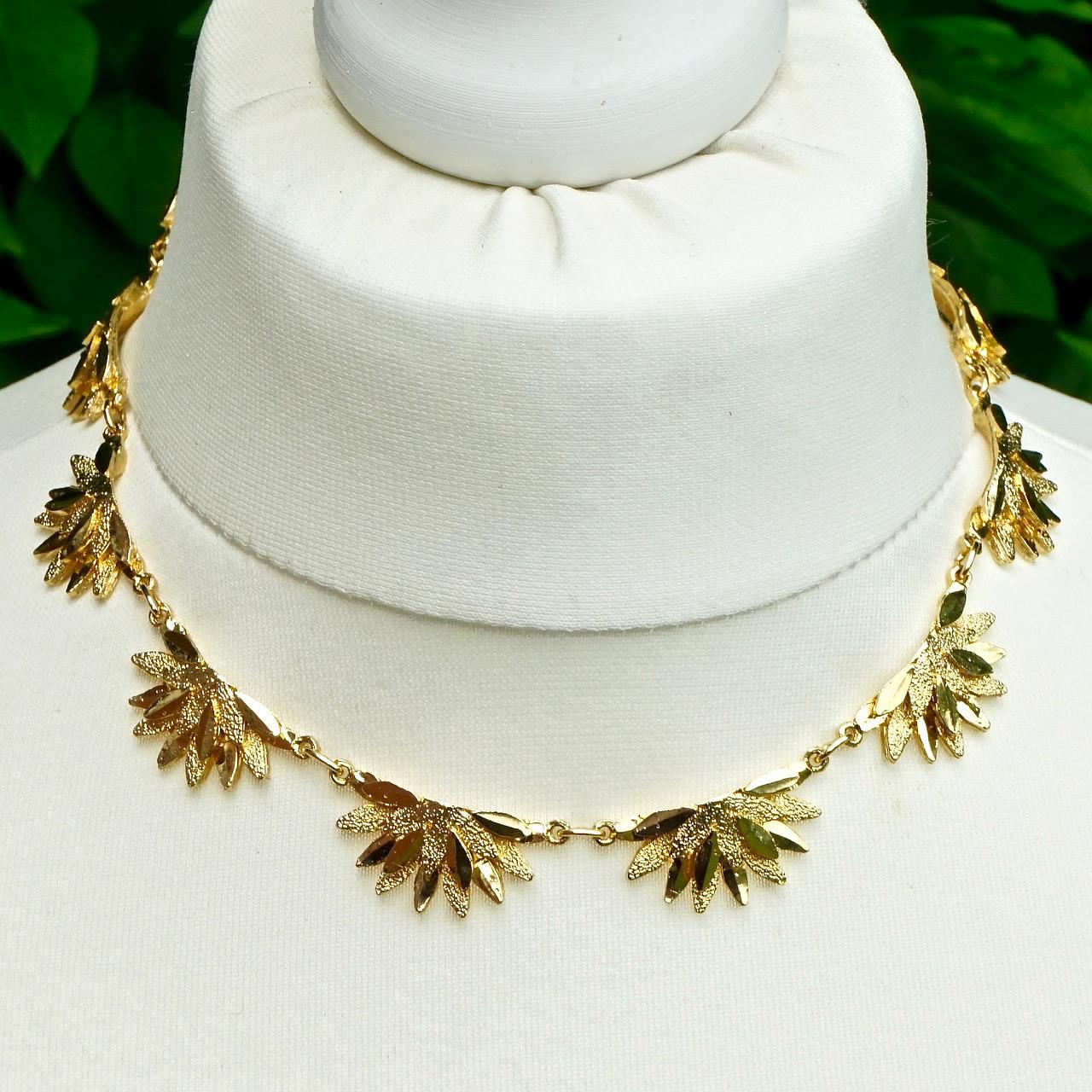 Fabulous gold plated necklace, featuring a brushed and shiny petal design. Measuring length 40 cm / 15.75 inches including the extension chain, by width 1.4 cm / .5 inch. The necklace is in very good condition, it has never been worn.

This stylish