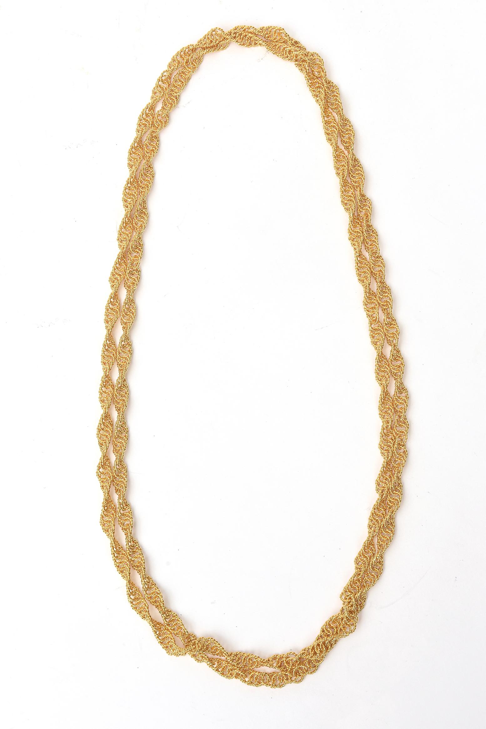 This fabulous long 1960's spiral chain wrap necklace is all gold plated and very rich looking. It can be worn so many different ways as a choker wrapped many times over or doubled or tripled on ones neck. It can be dressed up or down. The links are