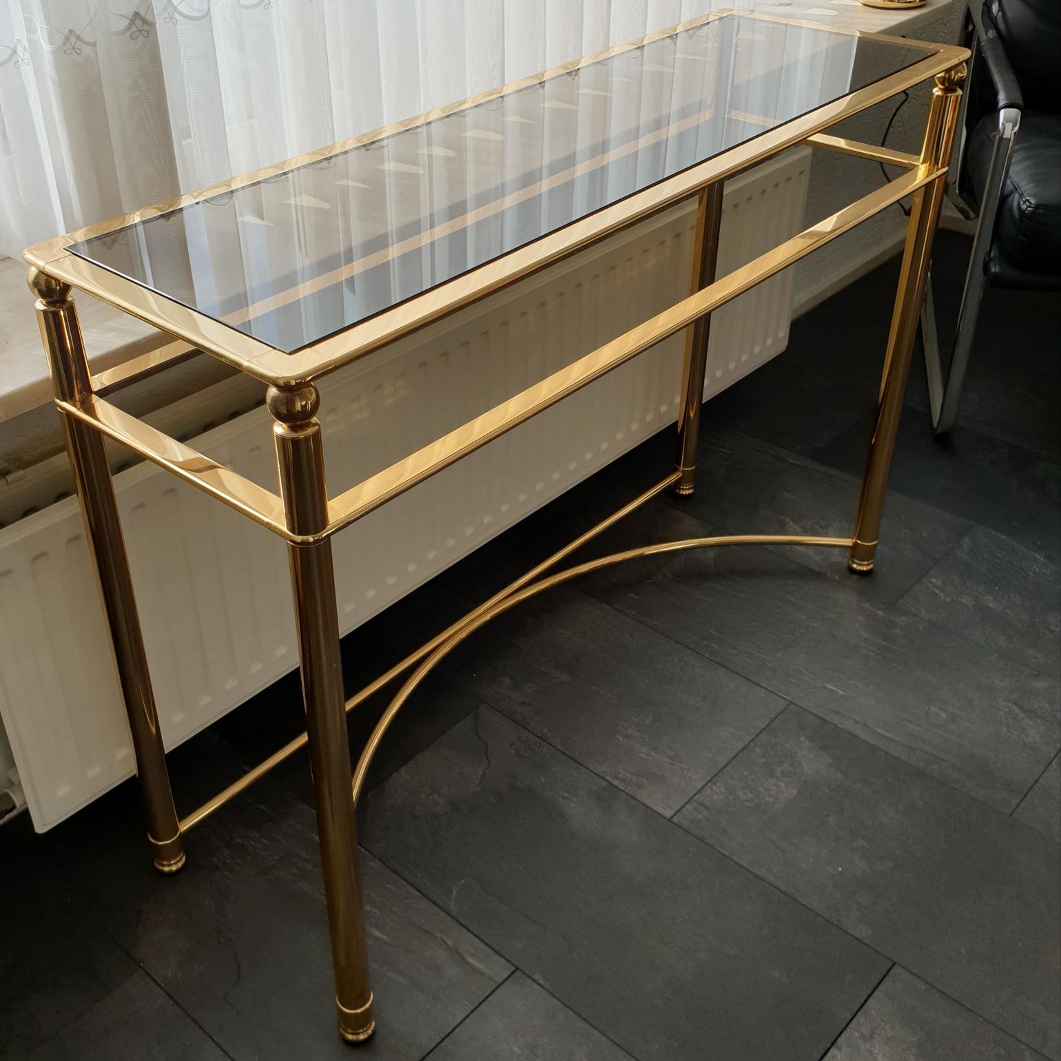 Gold-plated console table with smoked cut glass, 1980s
Heavy quality.
Hollywood Regency style.