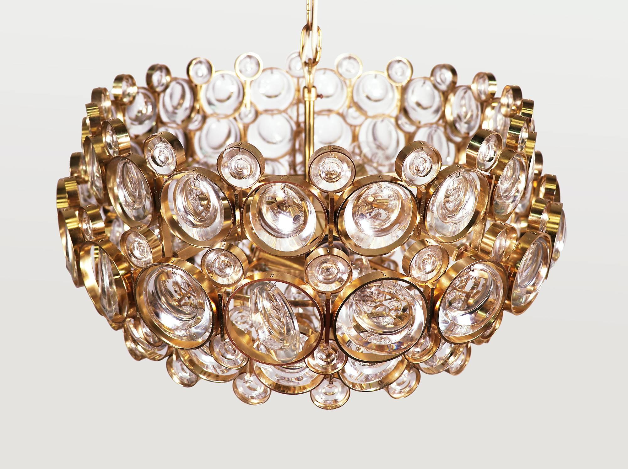 Glamorous multi-tiered bubble chandelier is made of a 24-carat gold-plated brass frame with crystal prisms and gilt brass rings. Designed in the 1960s by Gaetano Sciolari. Manufactured by Palwa (Palme & Walter), Germany in the 1960s. 

Design: