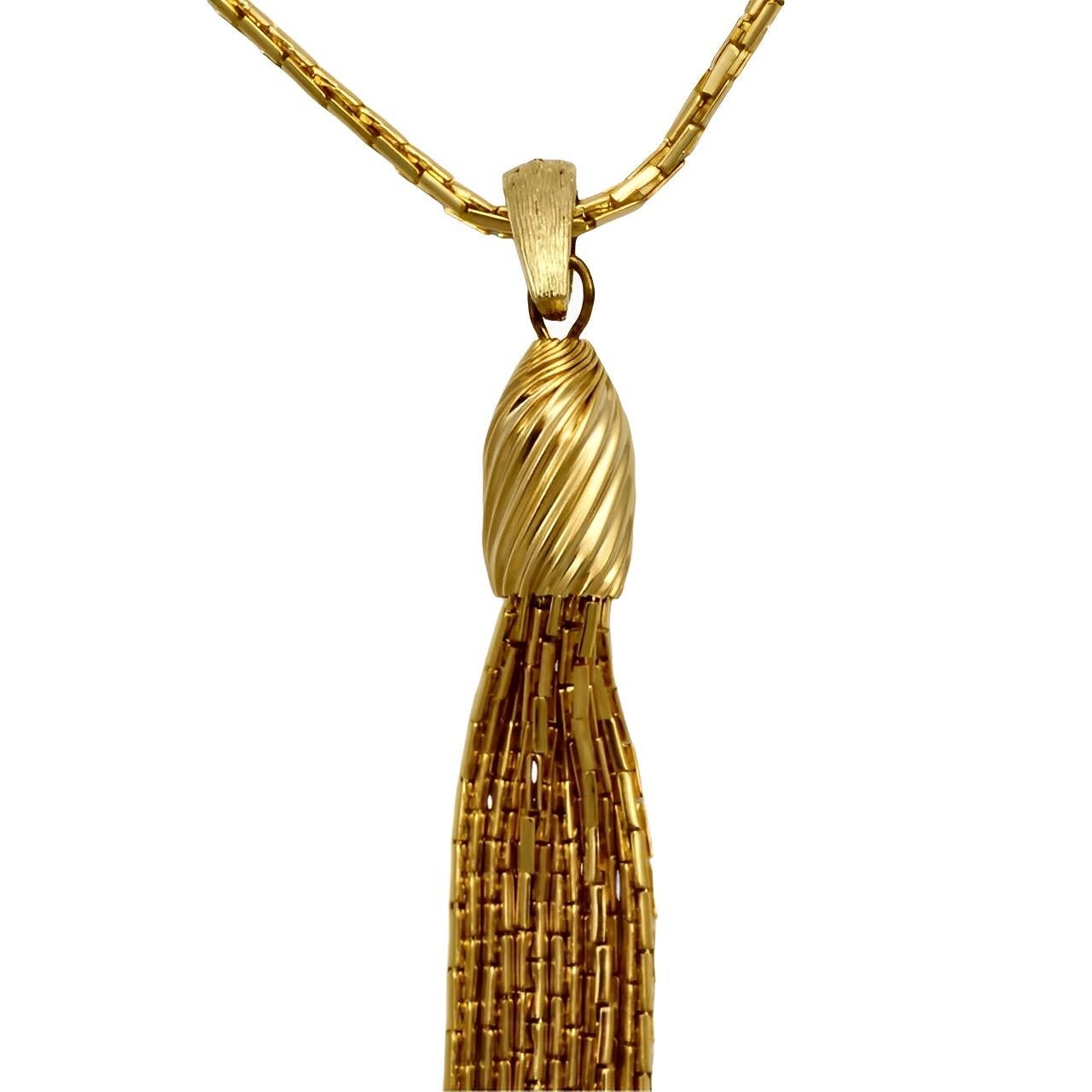 Gold plated elongated box chain necklace, featuring a lovely six strand tassel. Measuring length 55.5 cm / 21.8 inches, with an extension of 6.5 cm / 2.5 inches. The tassel pendant is length 10.5 cm / 4.1 inches. The necklace is in very good