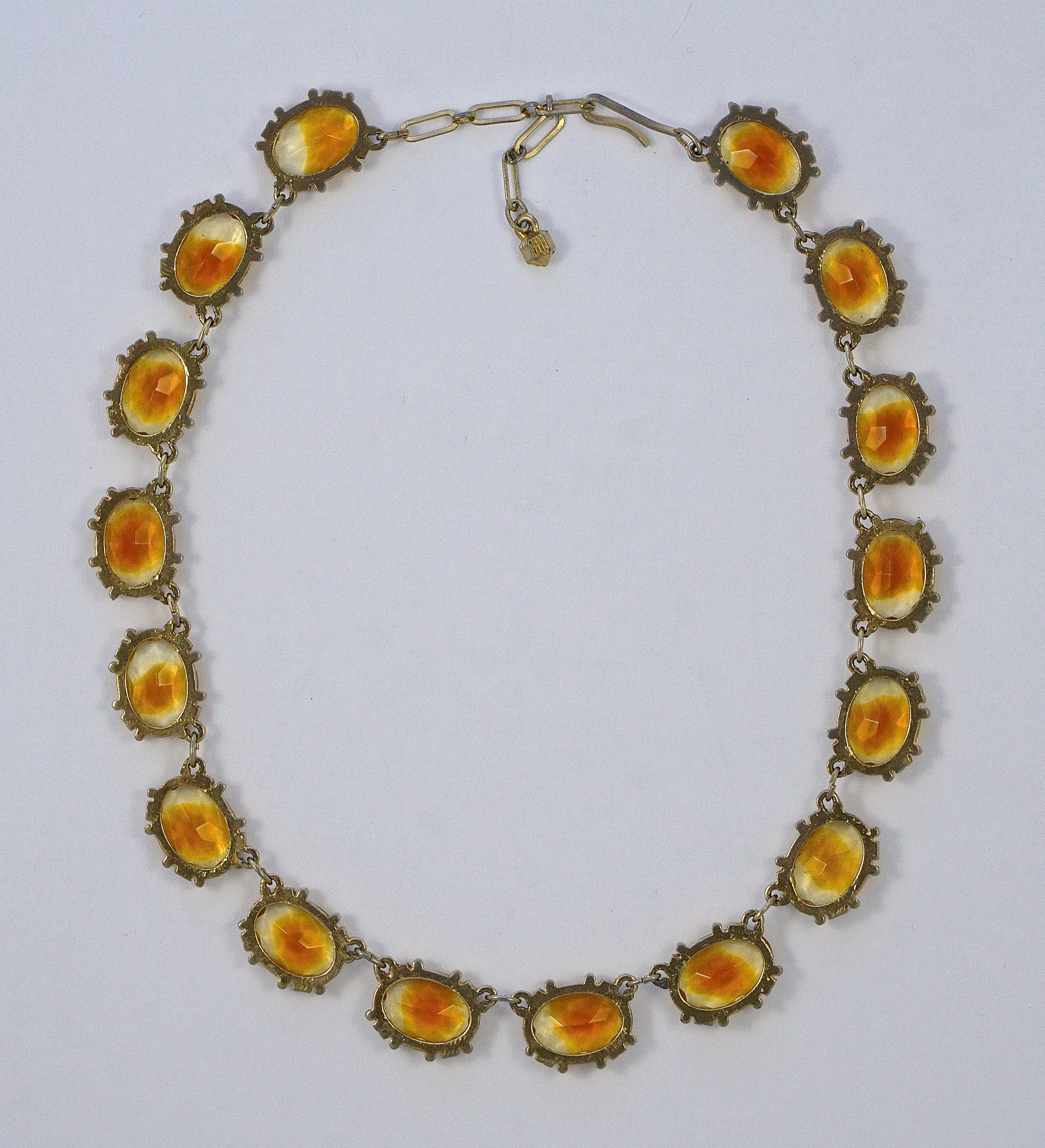 Wonderful gold plated rivière necklace set with oval amber and clear glass stones, they are faceted and open back to catch the light.  Measuring length 39.9cm / 15.7 inches by width 1.3cm / .5 inch, with an extension of 4.6cm / 1.8 inches. The
