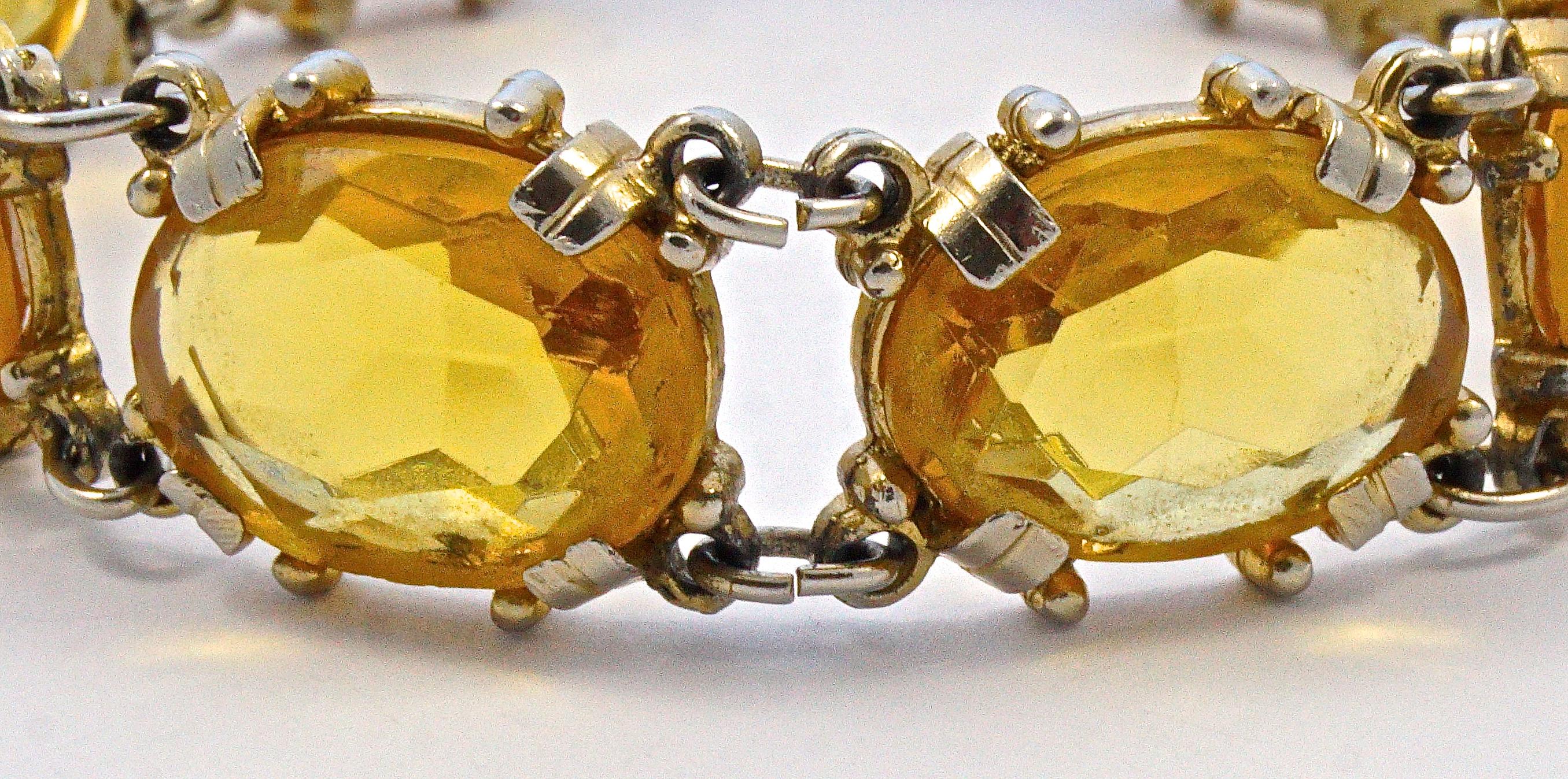 Wonderful gold plated bracelet set with oval citrine glass stones, they are faceted and open back to catch the light. Measuring length 19cm / 7.48 inches by width 1.3cm / .5 inch. The bracelet is in very good condition, with some scratching and