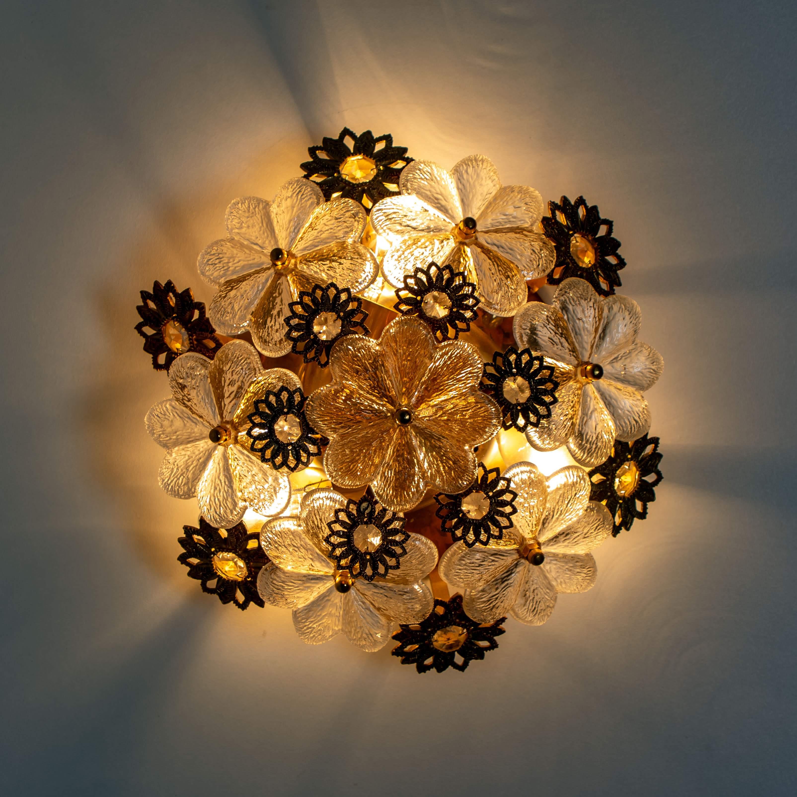 Stunning flower wall light/ flush mount by Palwa, Germany, circa 1965-1975. 
A luxurious of light fixture with beautifully cut flower crystals on a gold-plated brass frame.

In very good vintage condition. Cleaned, well wired and ready to use. He
