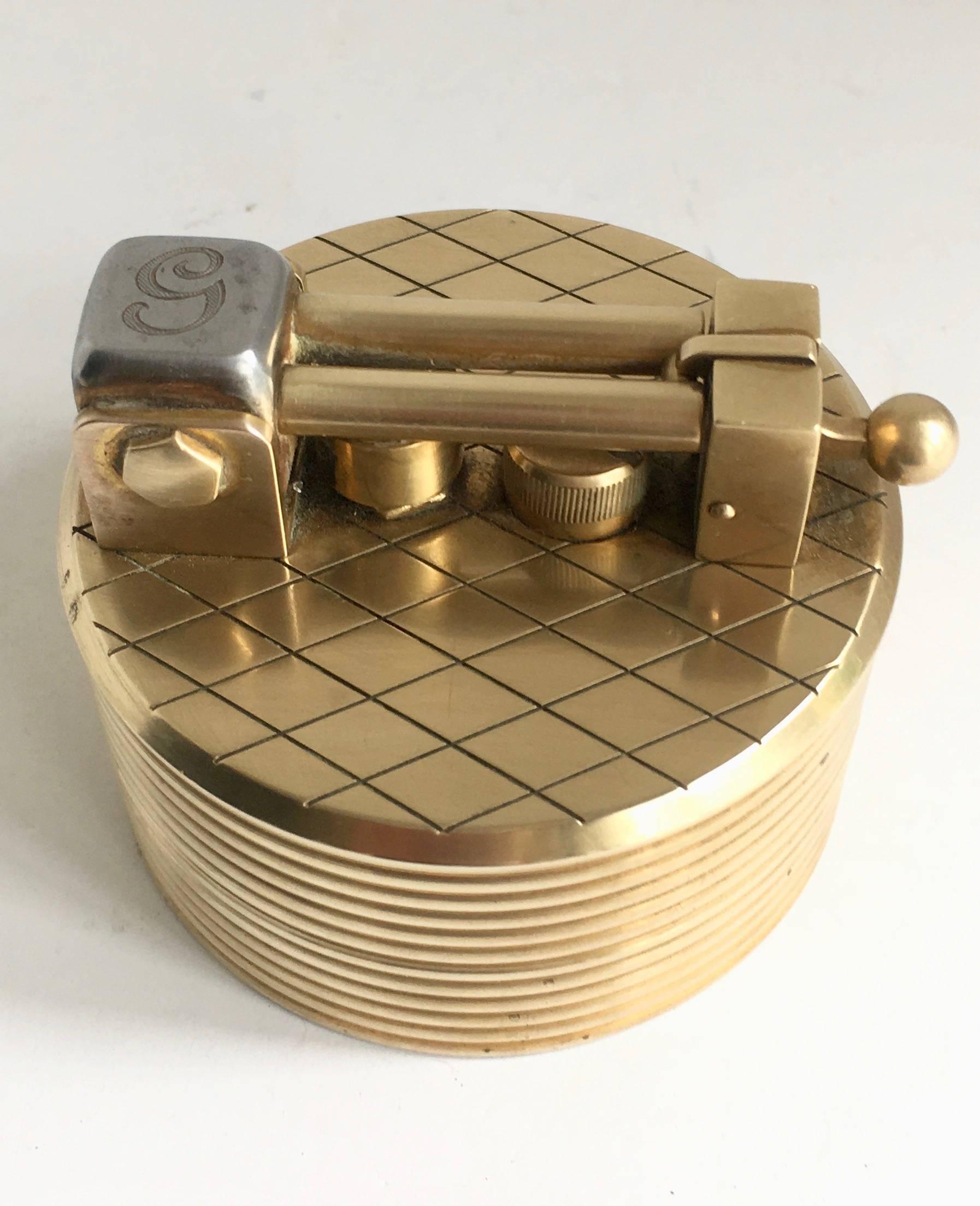 A gold-plated Gubelin lighter created by Dunhill in the 1960s - this piece is extraordinary and beautiful - Machine Age, industrial look... would be a great conversation piece or also could be used as a paper weight. While this does not currently