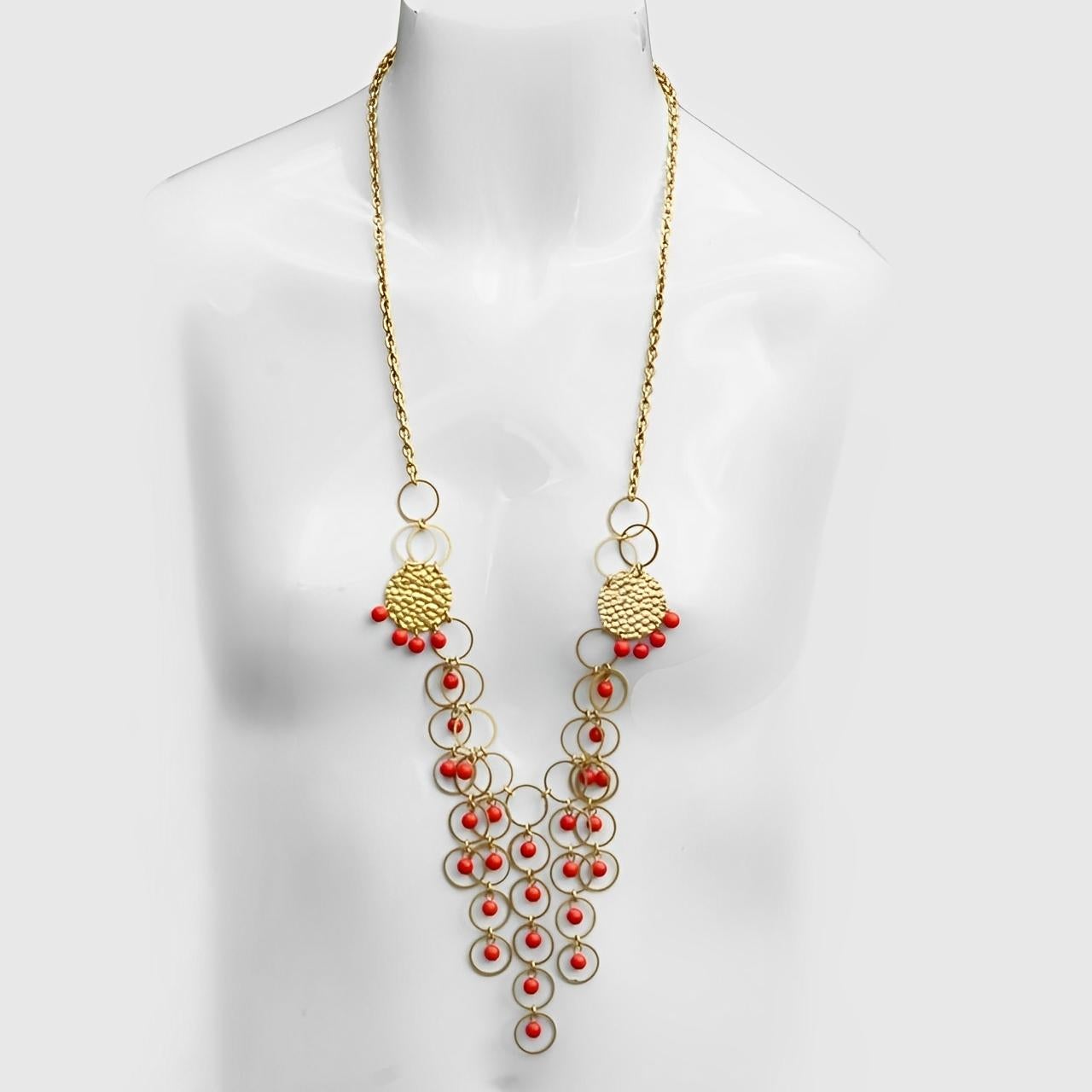 Wonderful gold plated hoop drops necklace, with plastic red coral beads, and textured round end pieces. There is no clasp.

Measuring necklace length 72 cm / 28.3 inches. The pendant is maximum length 10 cm / 3.9 inches.

This is a classic necklace