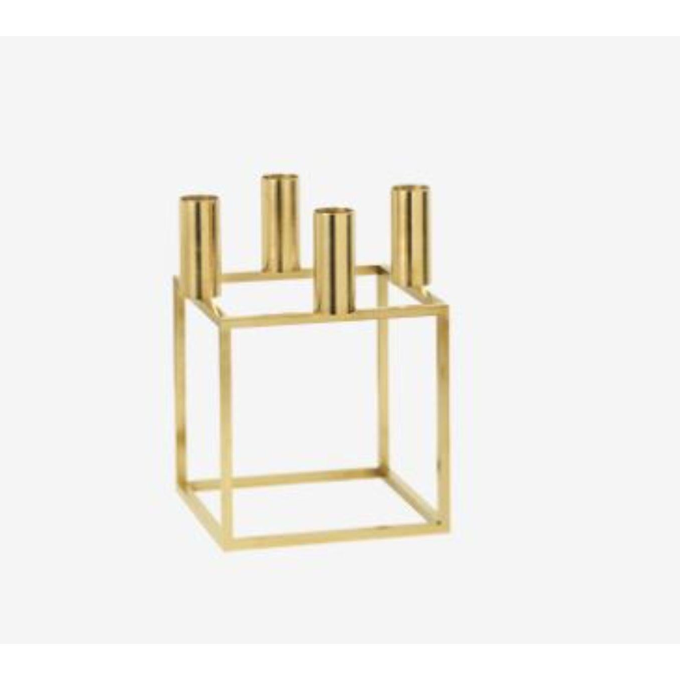 Gold Plated Kubus 4 candle holder by Lassen
Dimensions: D 14 x W 14 x H 20 cm 
Materials: Metal 
Also available in different dimensions. 
Weight: 1.50 Kg

A new small wonder has seen the light of day. Kubus Micro is a stylish, smaller version