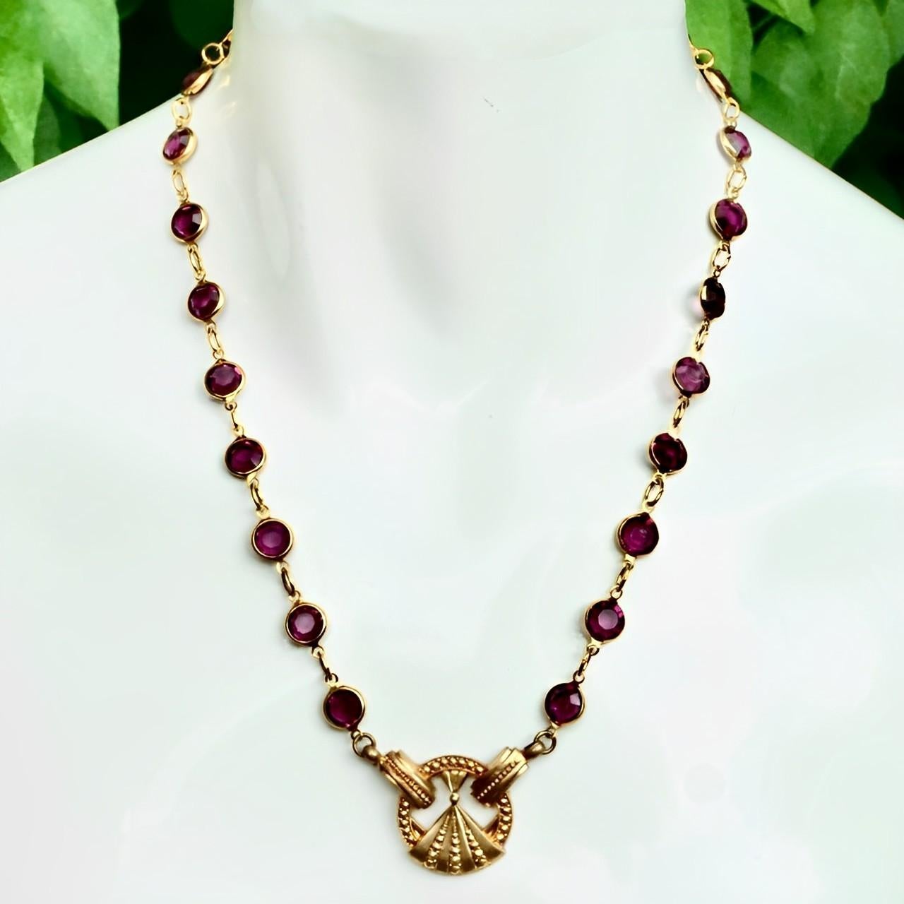 Gold plated necklace with lovely bezel set purple crystal links. The crystals are faceted and open back to catch the light. The vintage pendant is of an abstract Art Deco design.

Measuring length 50.7 cm / 19.9 inches and the pendant is diameter