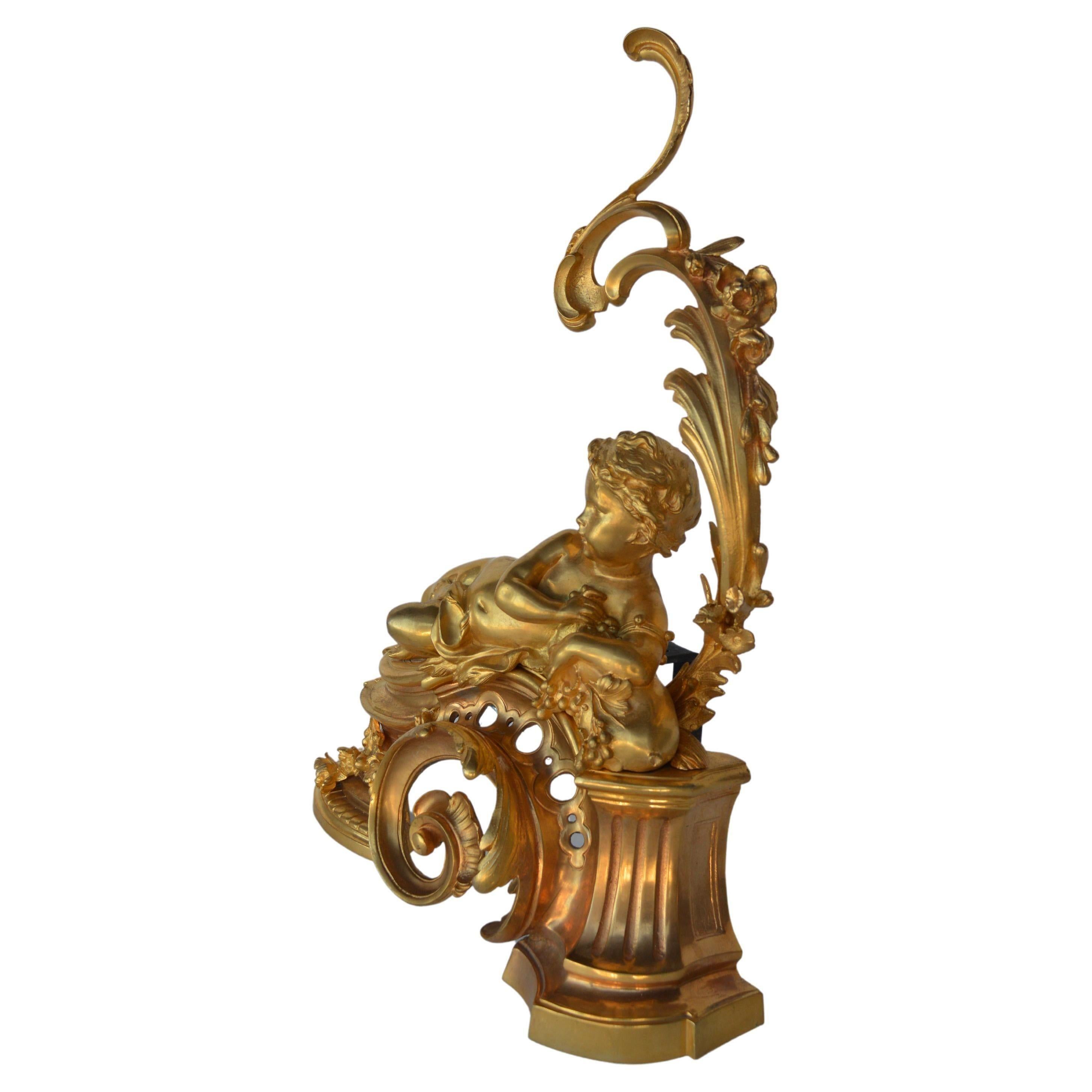 French bronze gold plated Louis XV style Andiron set with Cherub Motif.